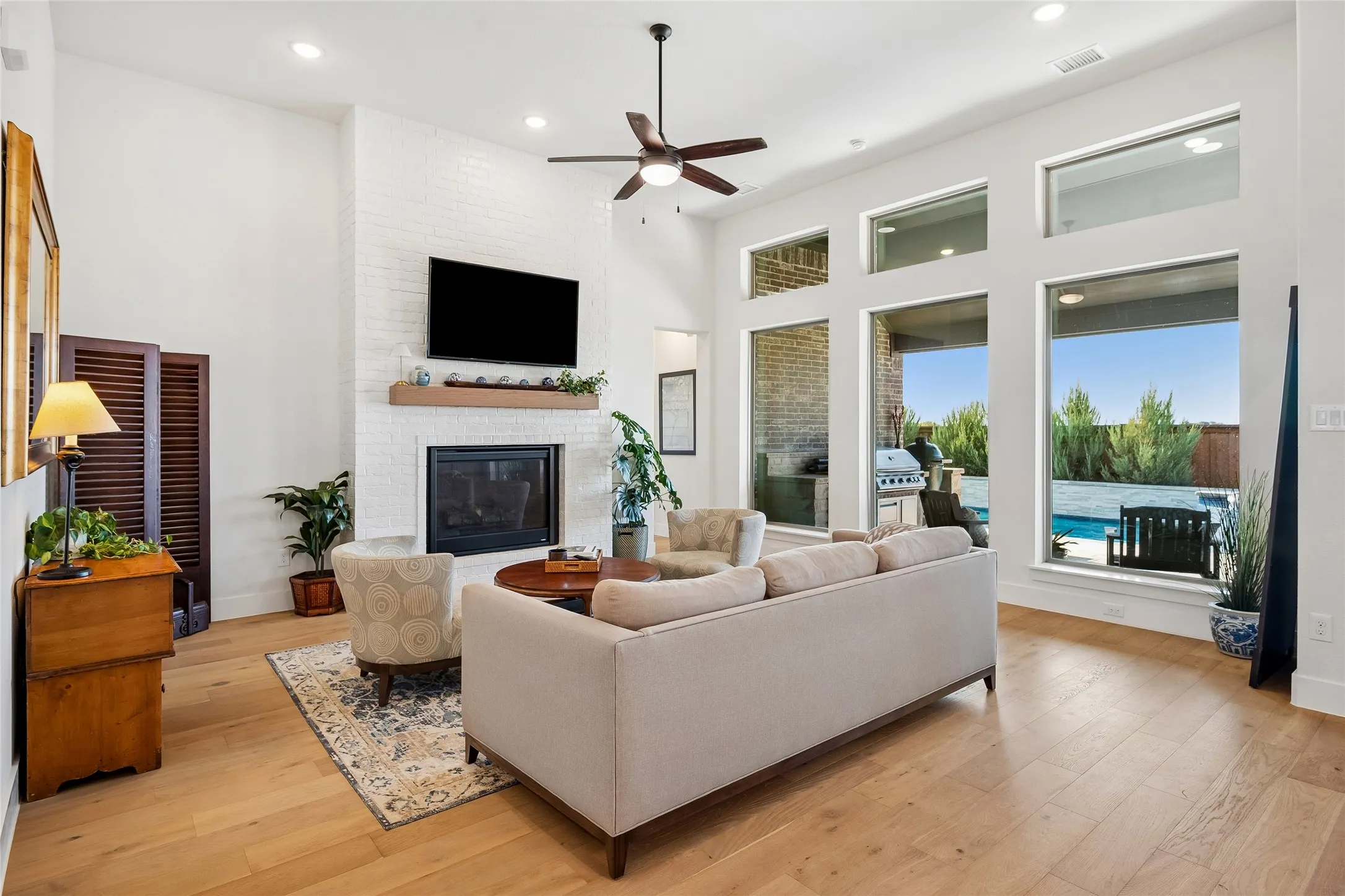 Transom windows add natural lighting to the family room.