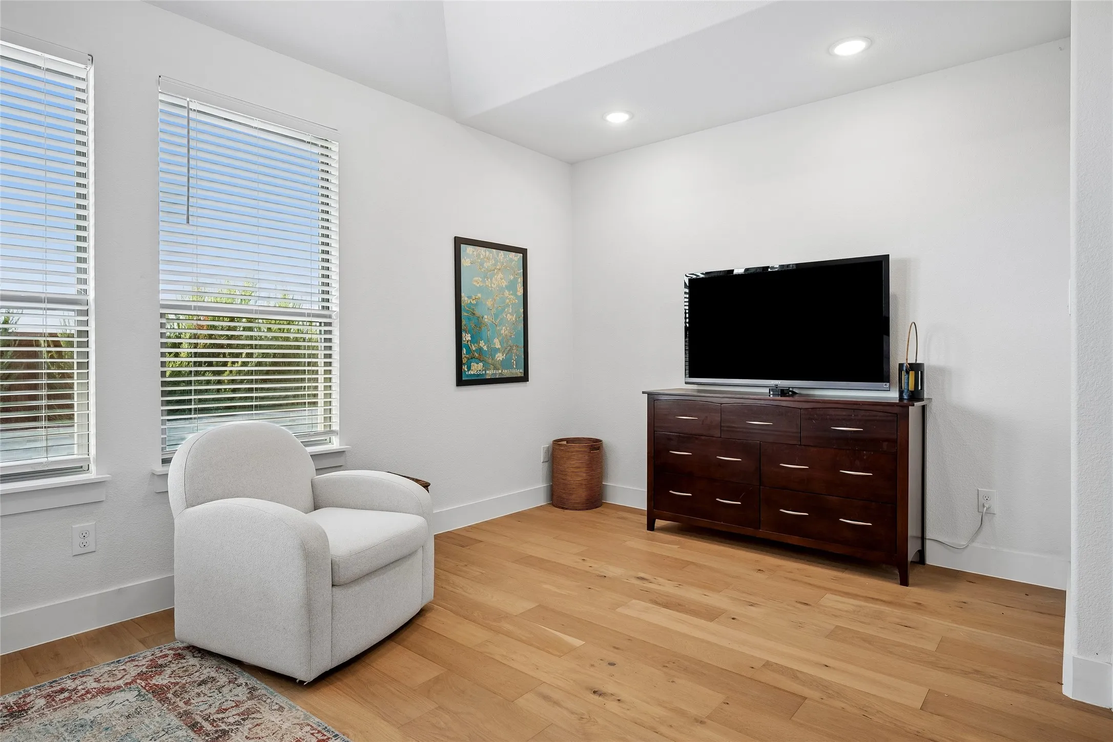 The spacious primary suite offers plenty of room for a sitting area.