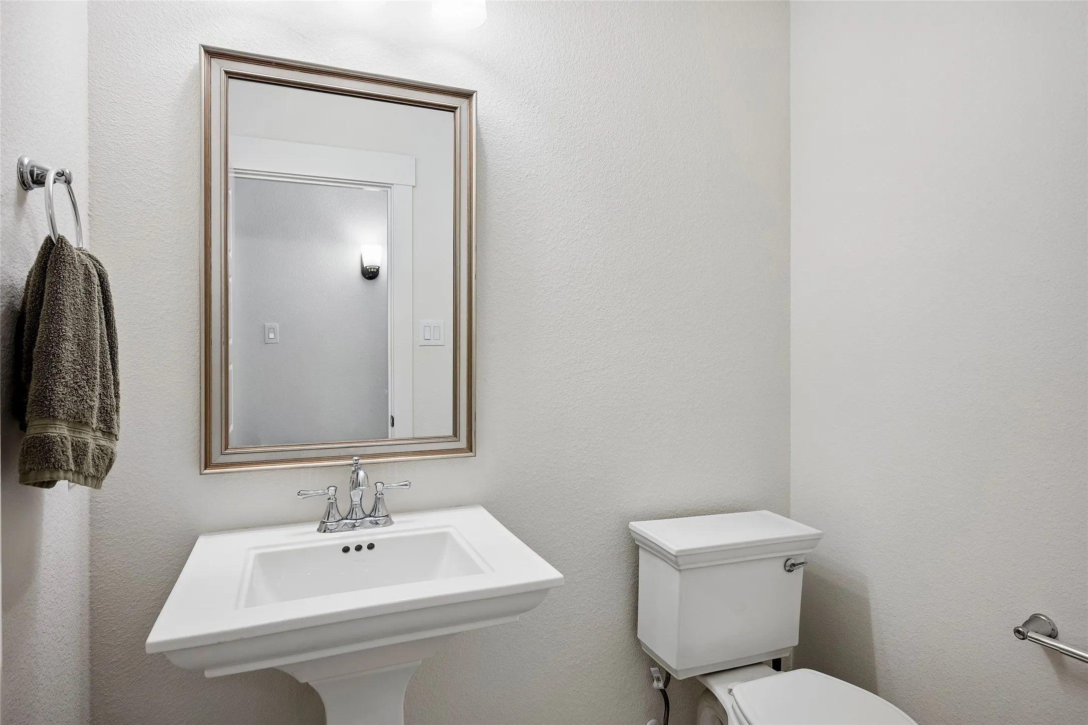 Half bath serving the game room and media room