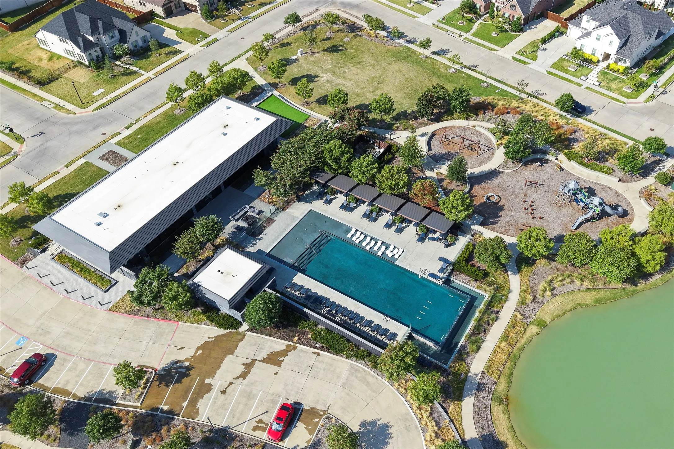 Aerial view of community center and pond