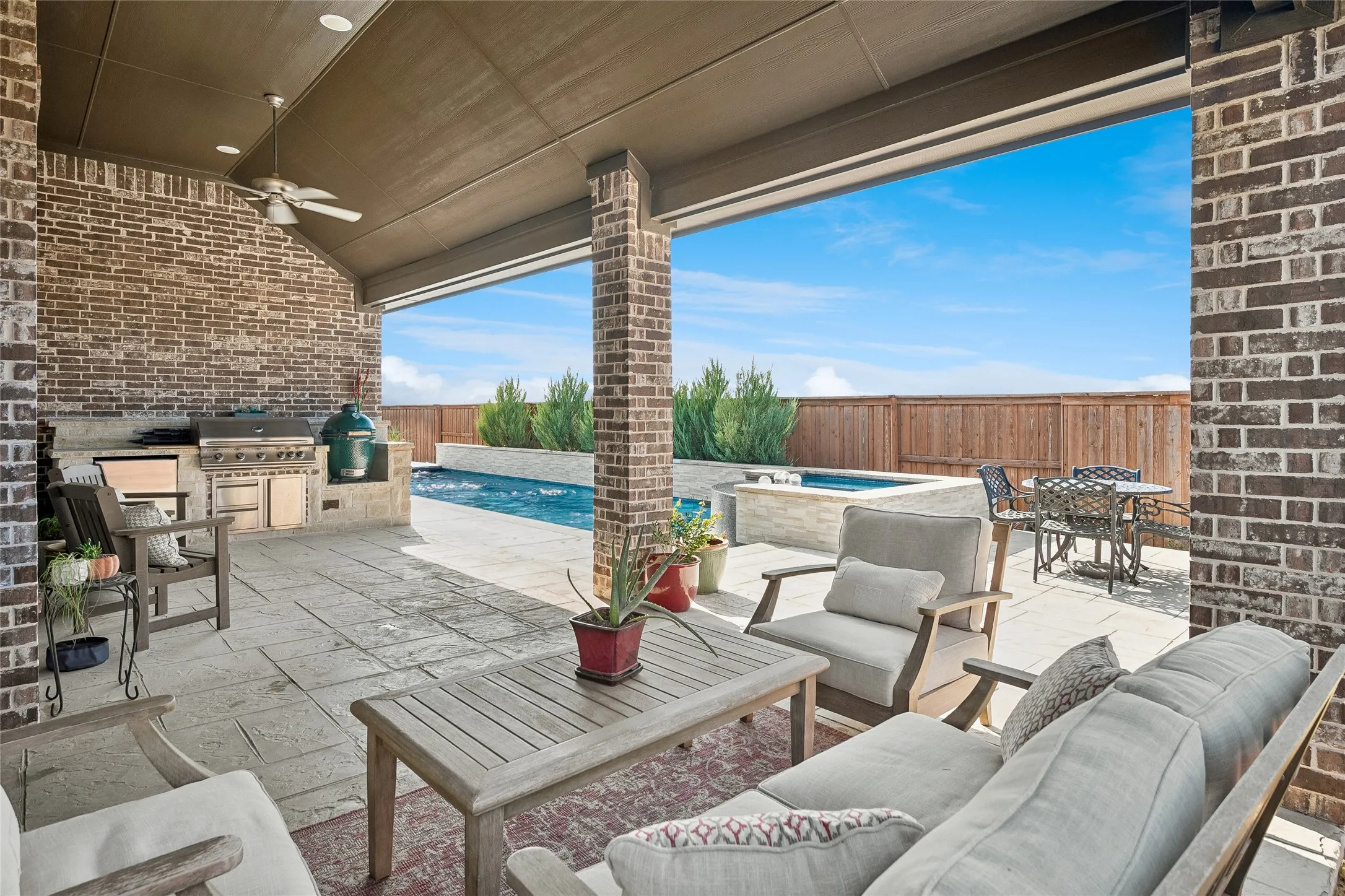 Delightful covered patio with cooking center and outdoor sitting area