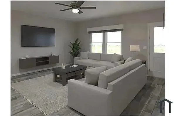 Recessed lighting, wood-finish flooring, ceiling fan, and large window with abundant natural light