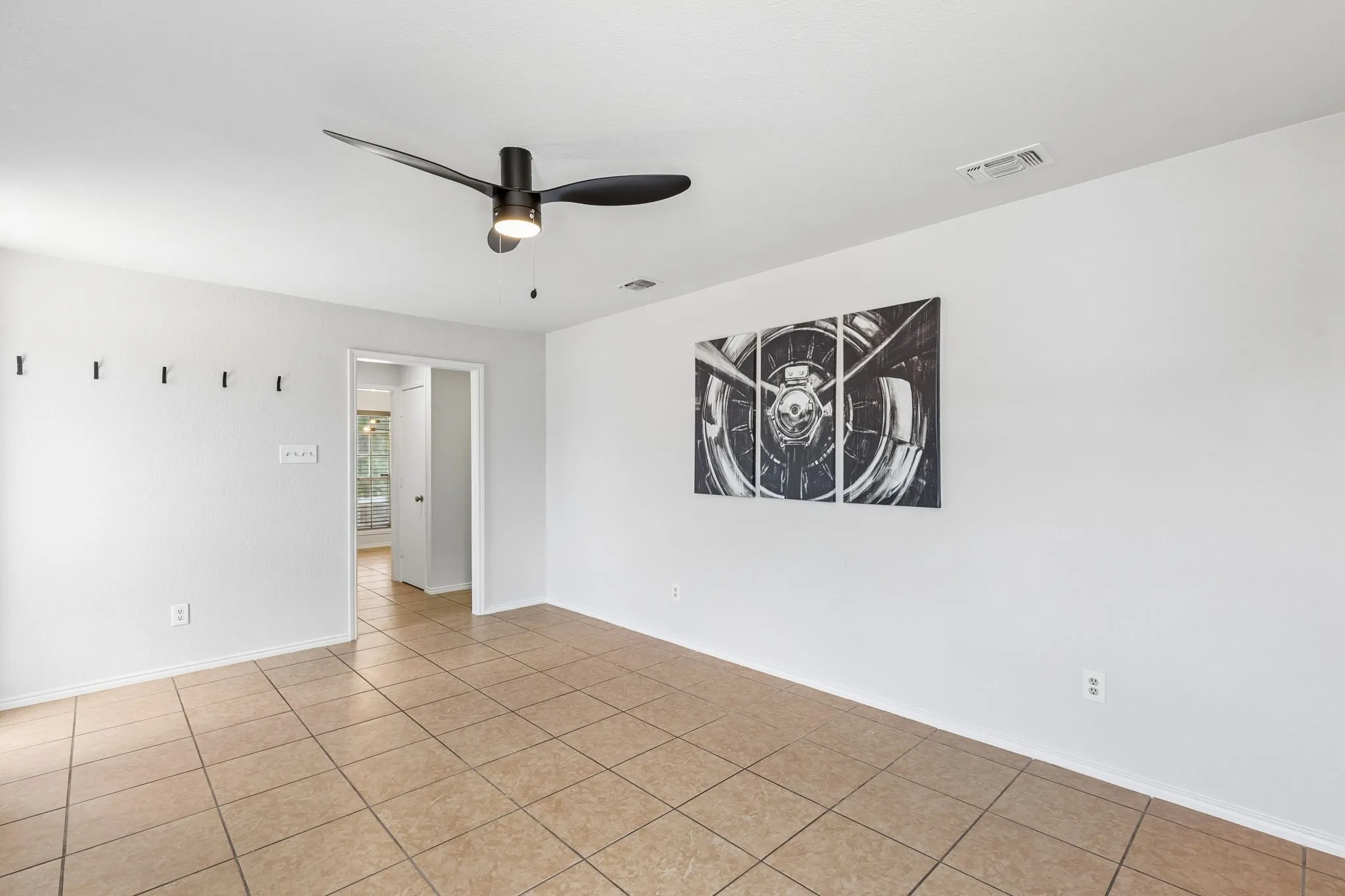 Tile flooring, recessed lighting, and a contemporary ceiling fan with integrated illumination