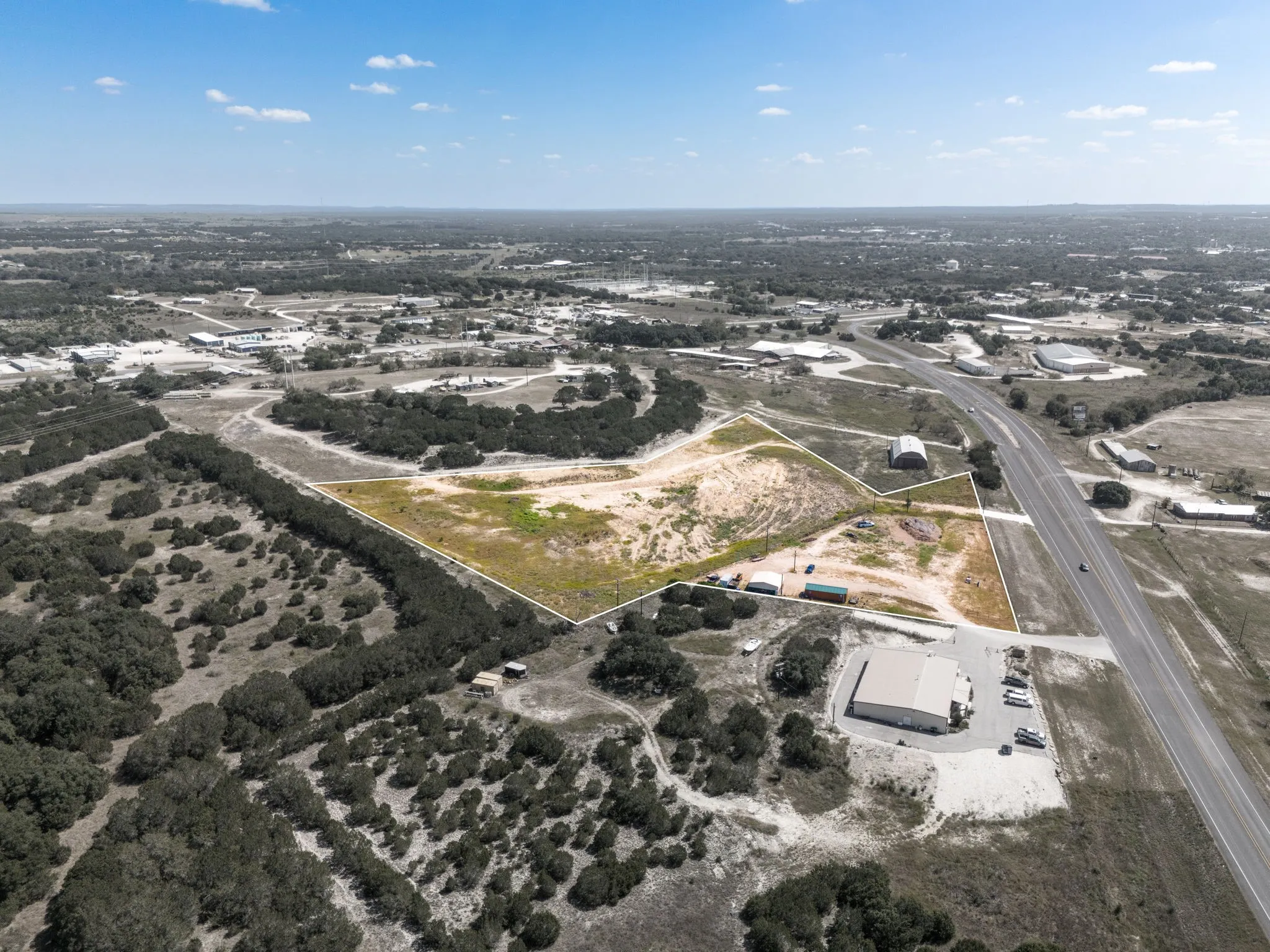 Expansive undeveloped land parcel with highway frontage