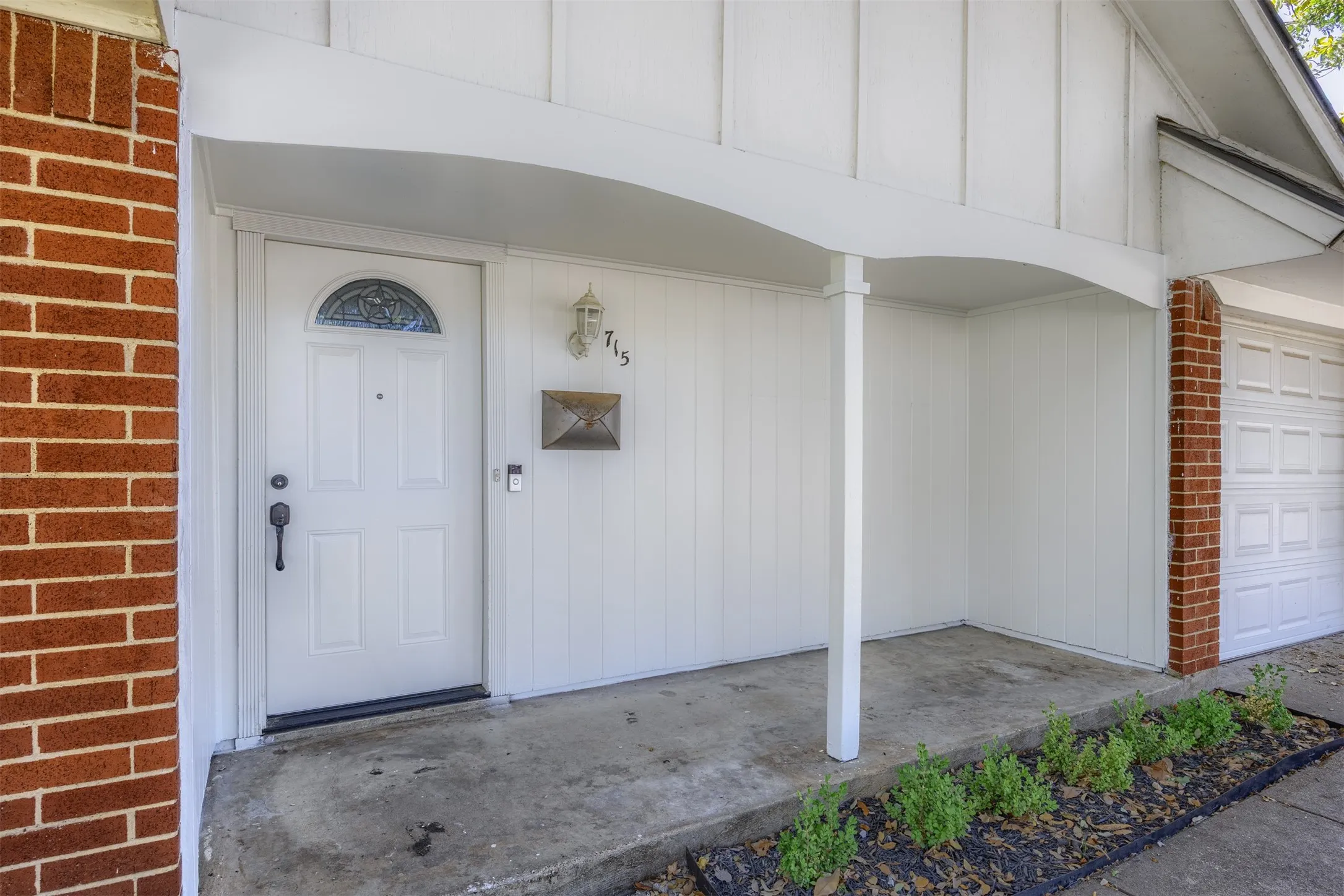Brick exterior with white board-and-batten siding