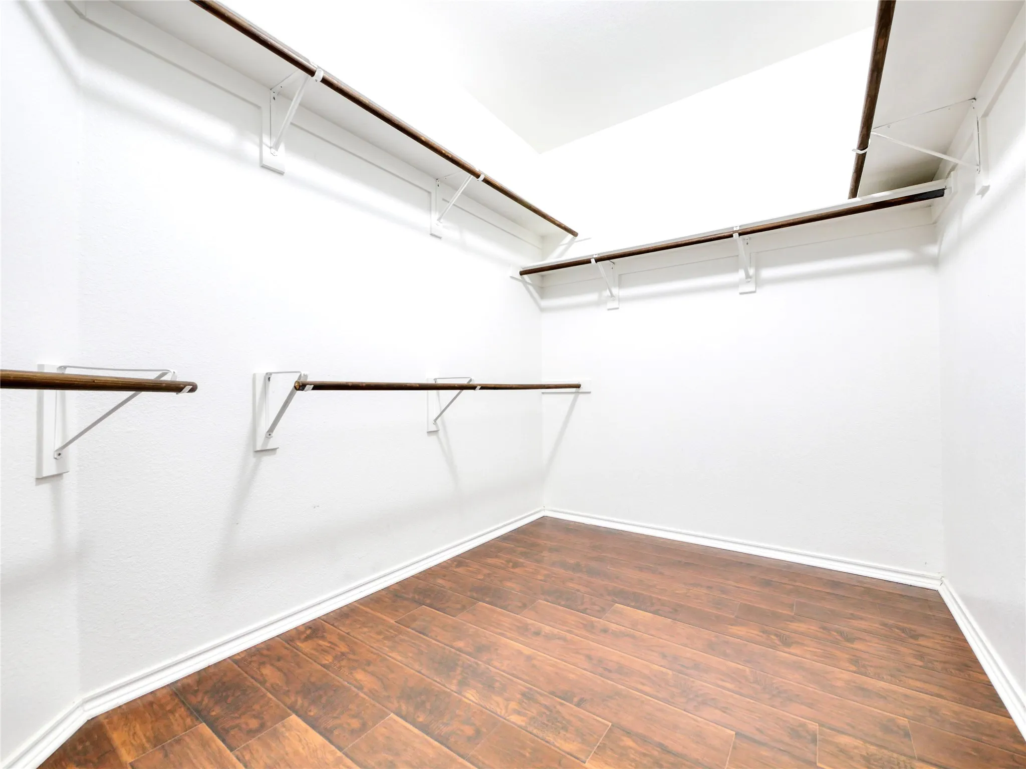 Walk in closet in primary bedroom