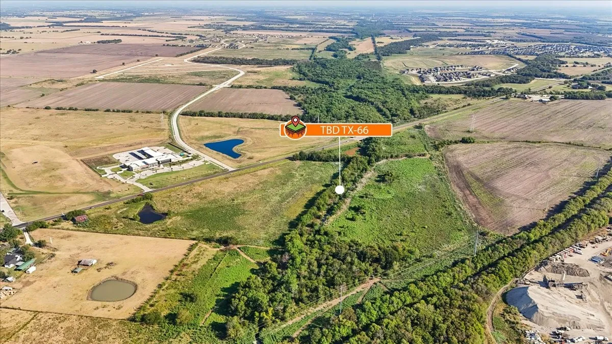 Extensive acreage featuring diverse terrain, bordered by mature tree lines, and encompassing open fields
