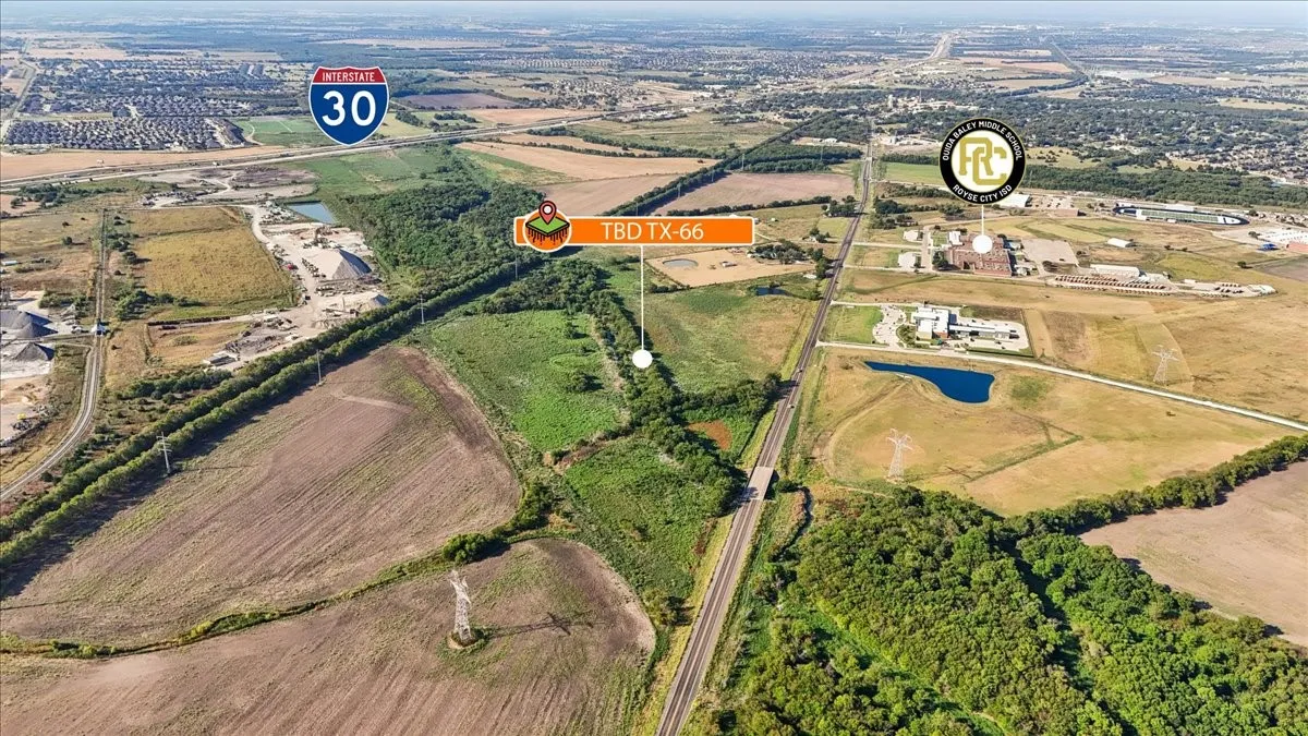 Expansive undeveloped land featuring proximity to Interstate 30, natural tree lines, and open fields
