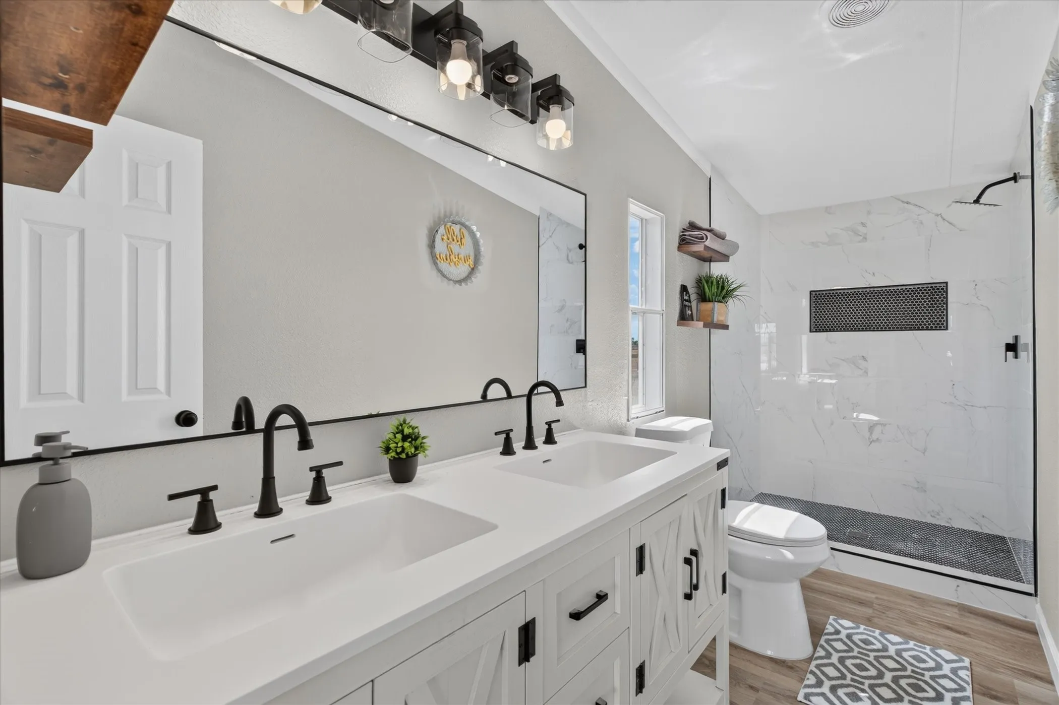 Dual vanity with undermount sinks and matte black fixtures
