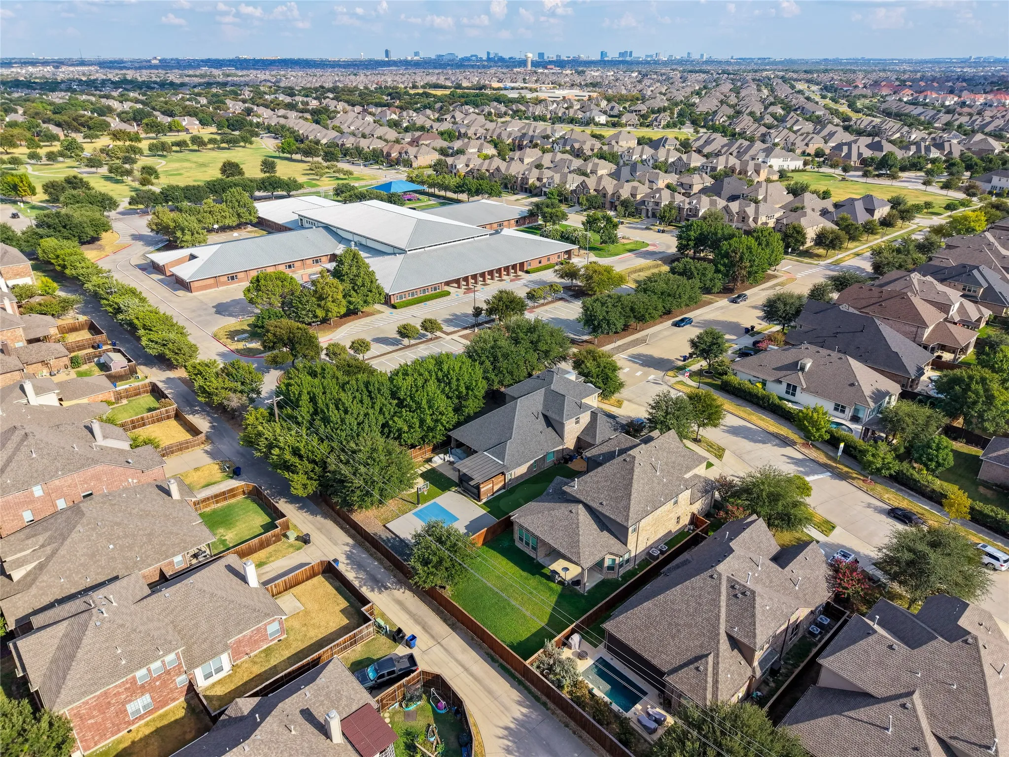 Residences with private swimming pools set in a suburban landscape