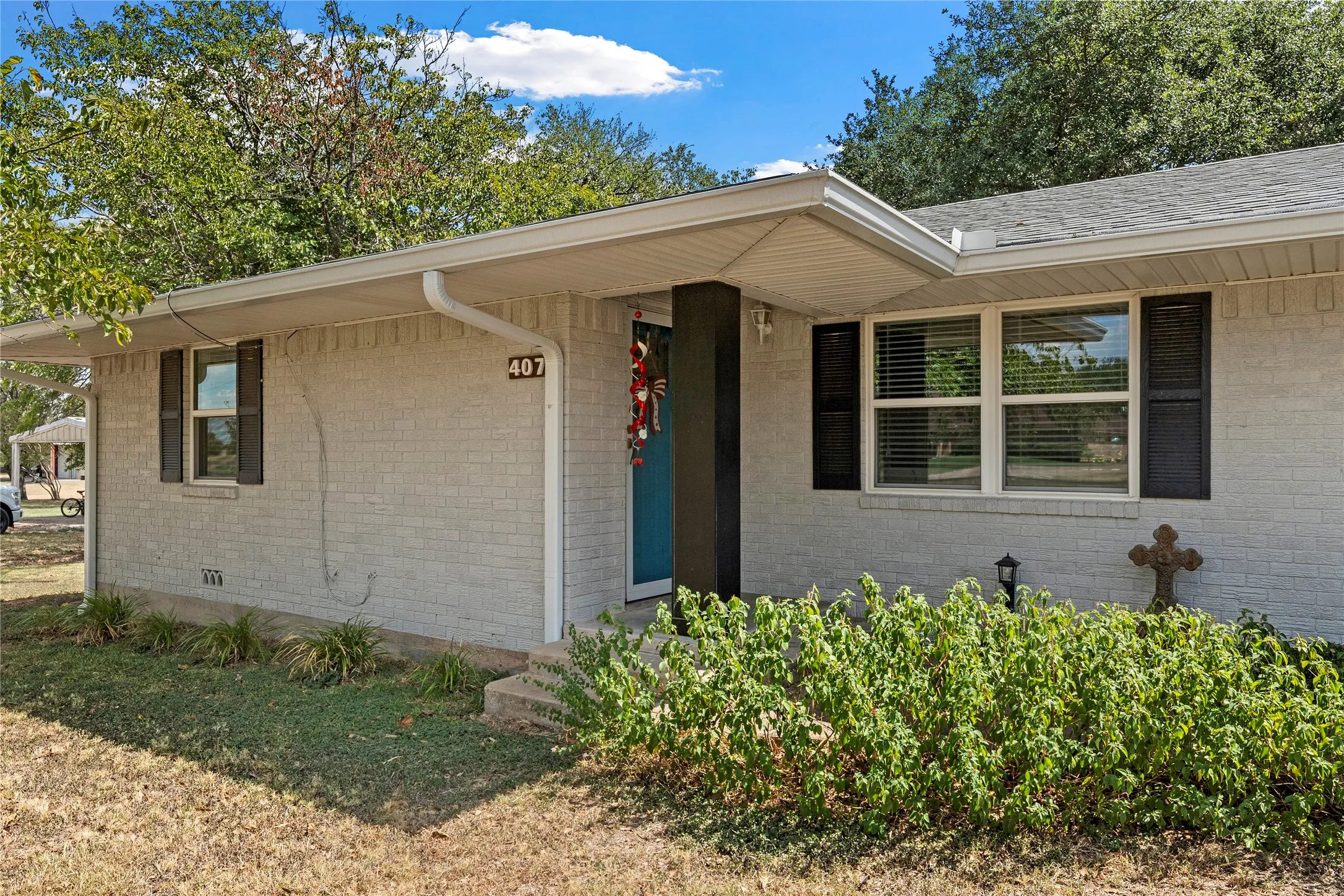 Brick exterior with a covered entry