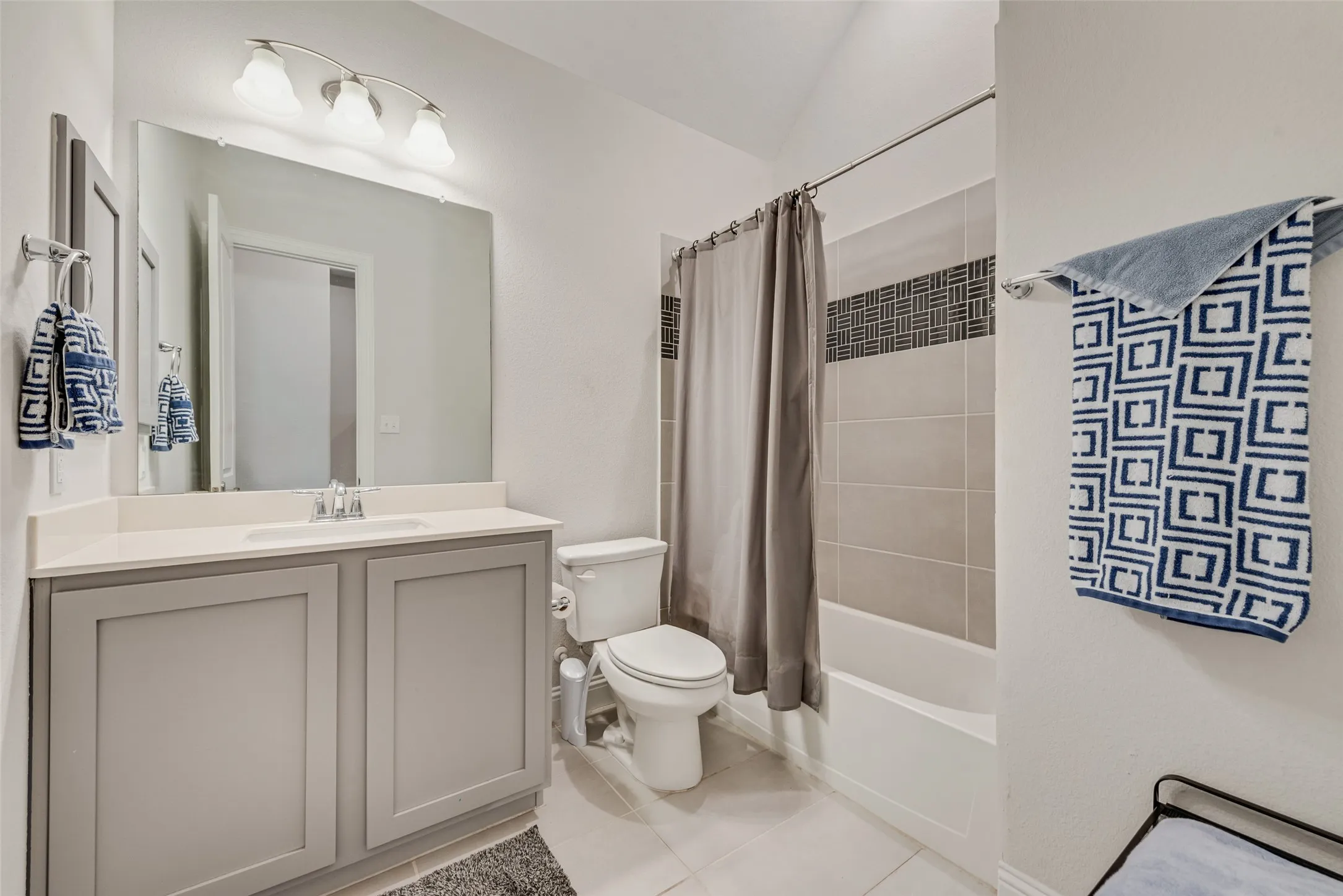 Front bathroom with 11 ft ceiling and shaker cabinets at 1721 Pattenson Trl, Haslet, TX 76052 in Wellington subdivision