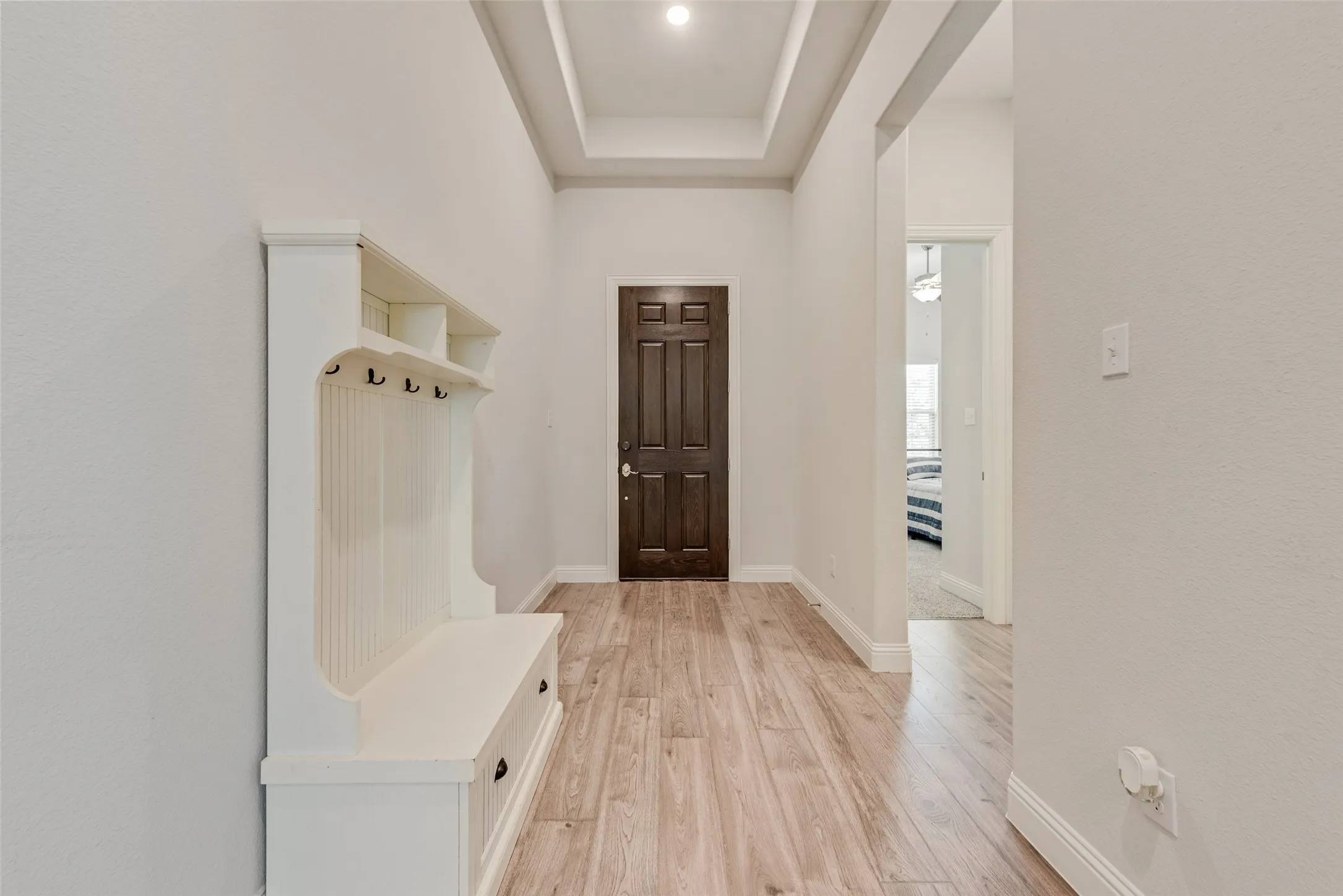 Front entry with engineered hardwood floors and 11 ft ceilings at 1721 Pattenson Trl, Haslet, TX 76052 in Wellington subdivision