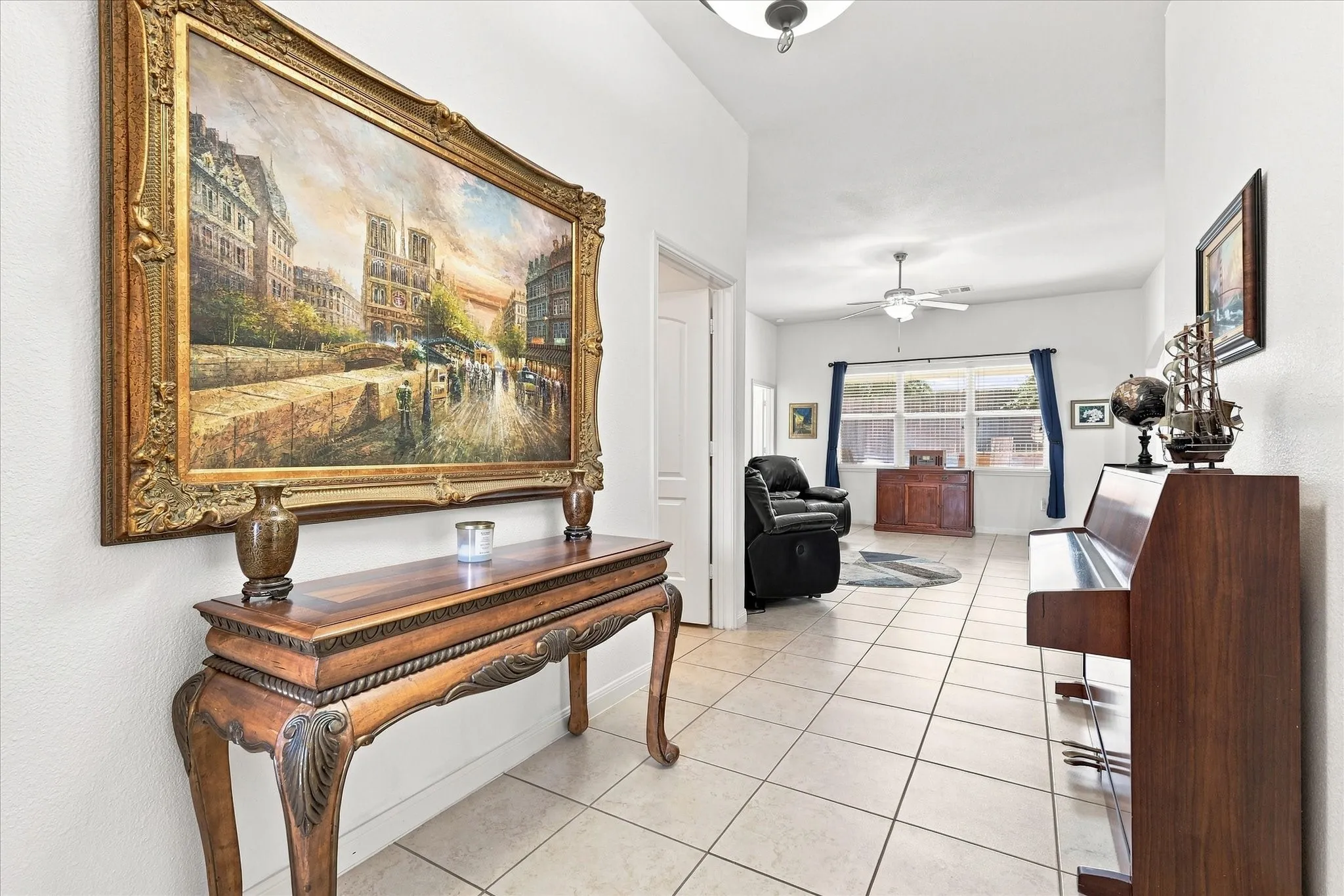 he wide entryway features tall ceilings and neutral tile flooring, leading past a piano space into the main living areas. This clean, move-in ready home is completely updated and waiting for you