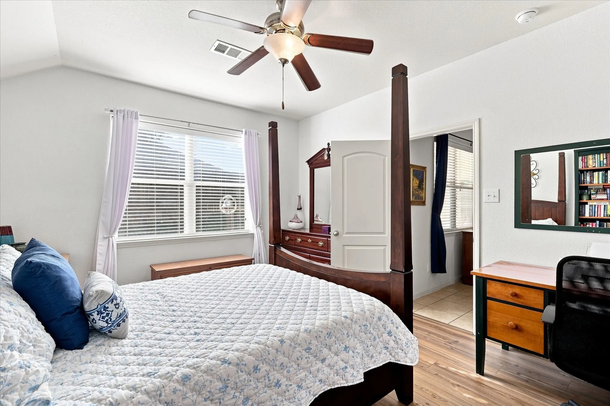 The private primary suite is split from the ancillary bedrooms for maximum privacy. It features bright windows he spacious primary bedroom highlights the brand-new, modern Luxury Plank Vinyl (LPV) flooring and clean white walls. With zero carpet throughout the home, this property offers low-maintenance living and is perfect for anyone looking for an allergen-free environment