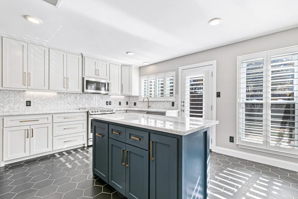 Granite Countertop, Plantation Shutters, Marble backsplash, soft close drawers.