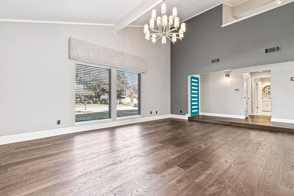 Tall beamed ceiling with fireplace