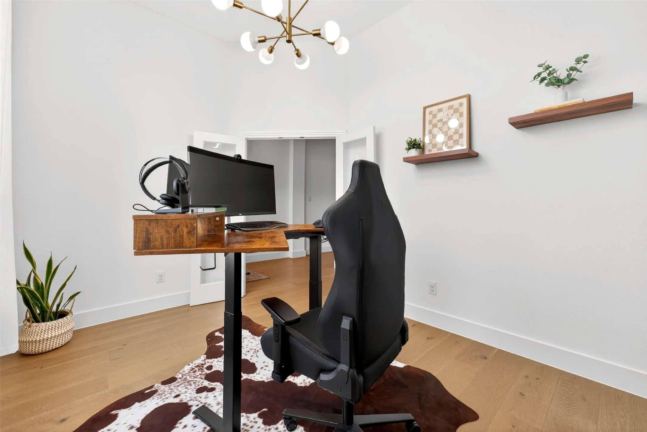 Wood-finish flooring with white walls and trim
