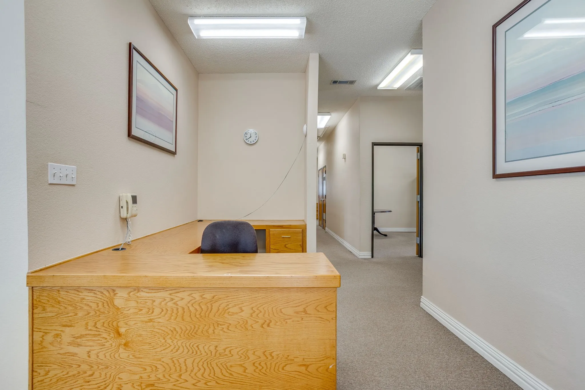 Built-in reception desk with a wood-finish surface