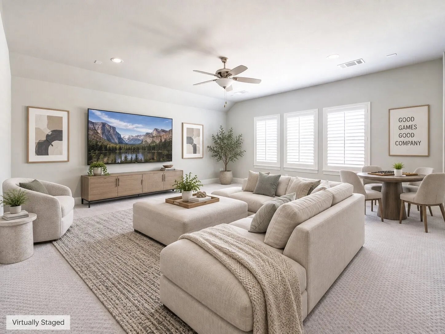 Recessed lighting, ceiling fan, multiple windows with white shutters, wall-mounted media console, and carpet flooring