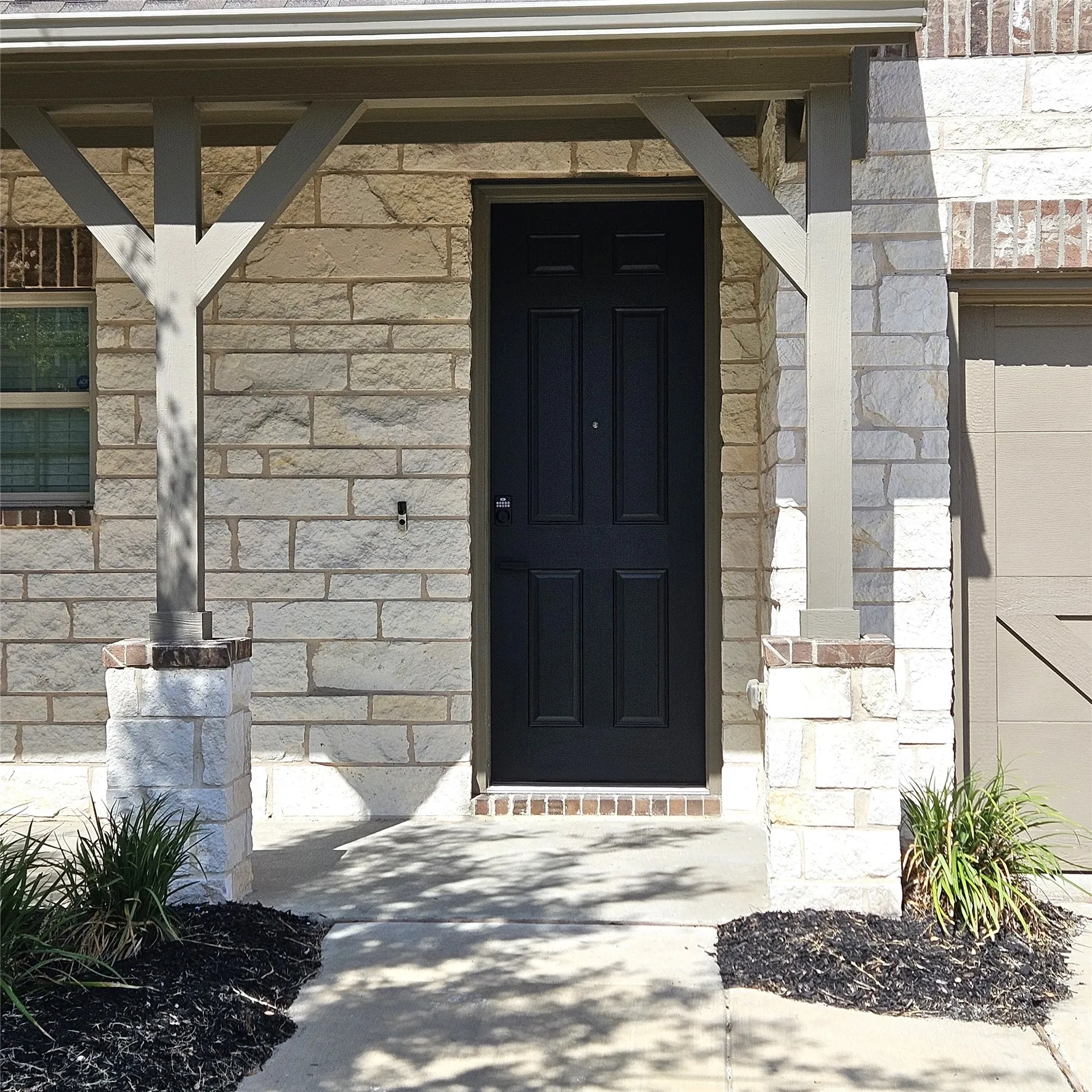 Stone veneer exterior with brick accents
