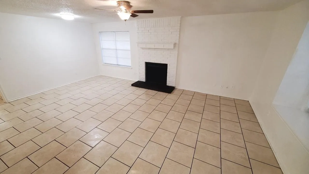 open concept living room with big windows (For 3427 Republic)