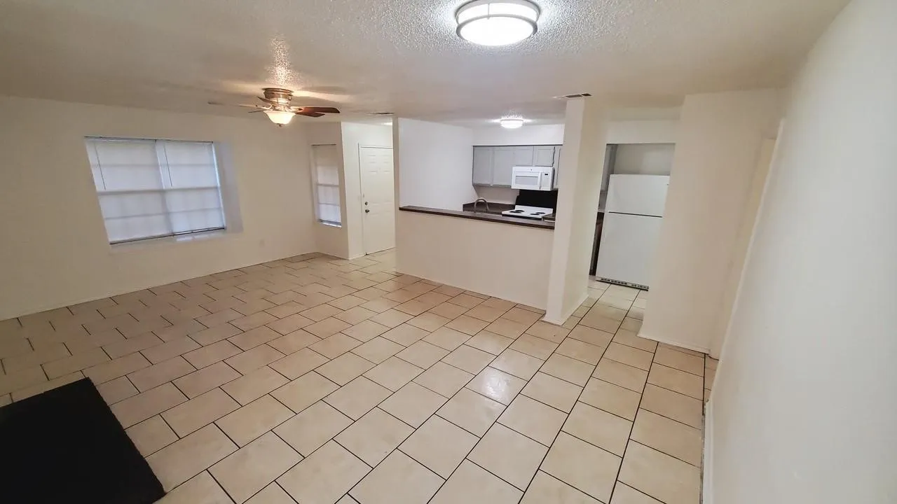 open concept living room with big windows (For 3427 Republic)
