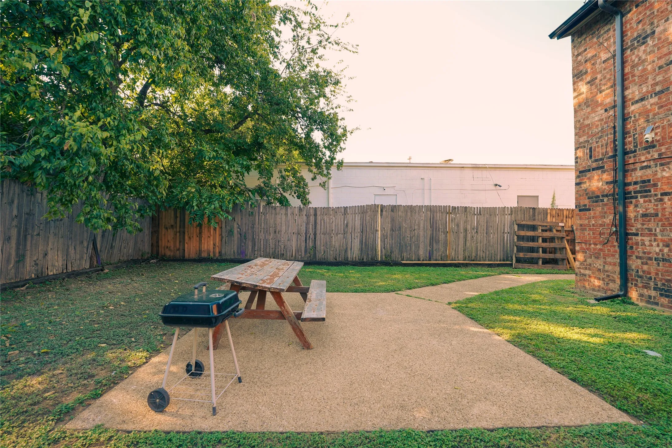 Fenced backyard featuring a patio