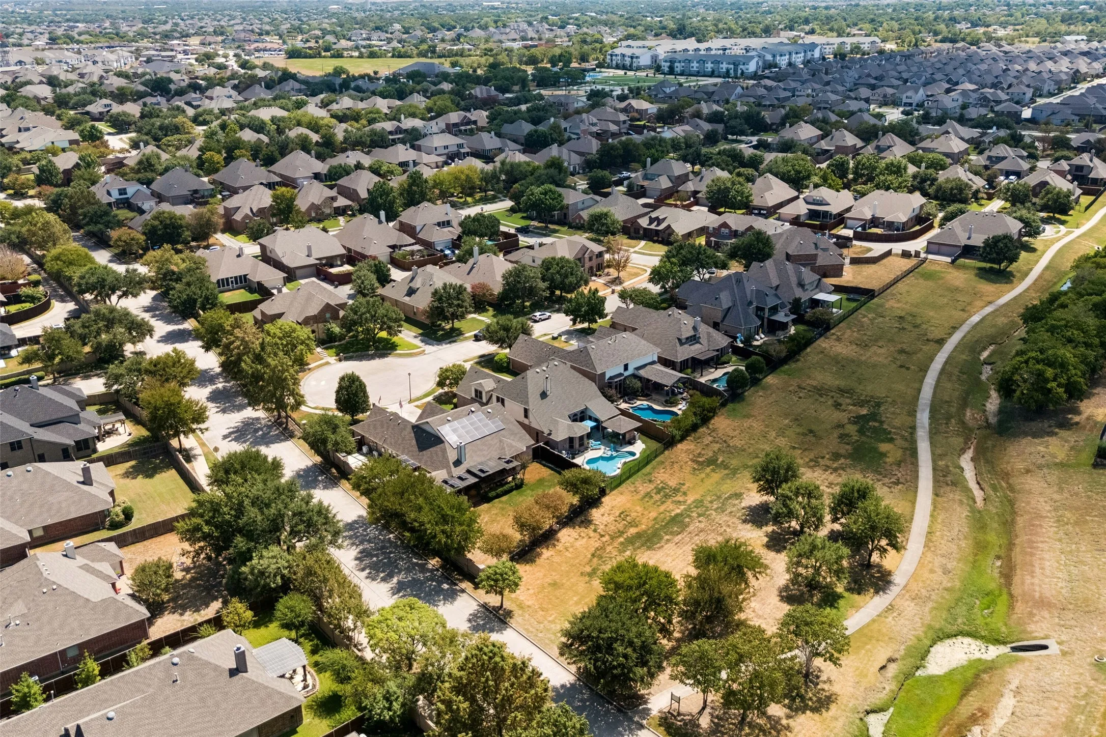 Residential neighborhood with mature trees, and walking trails
