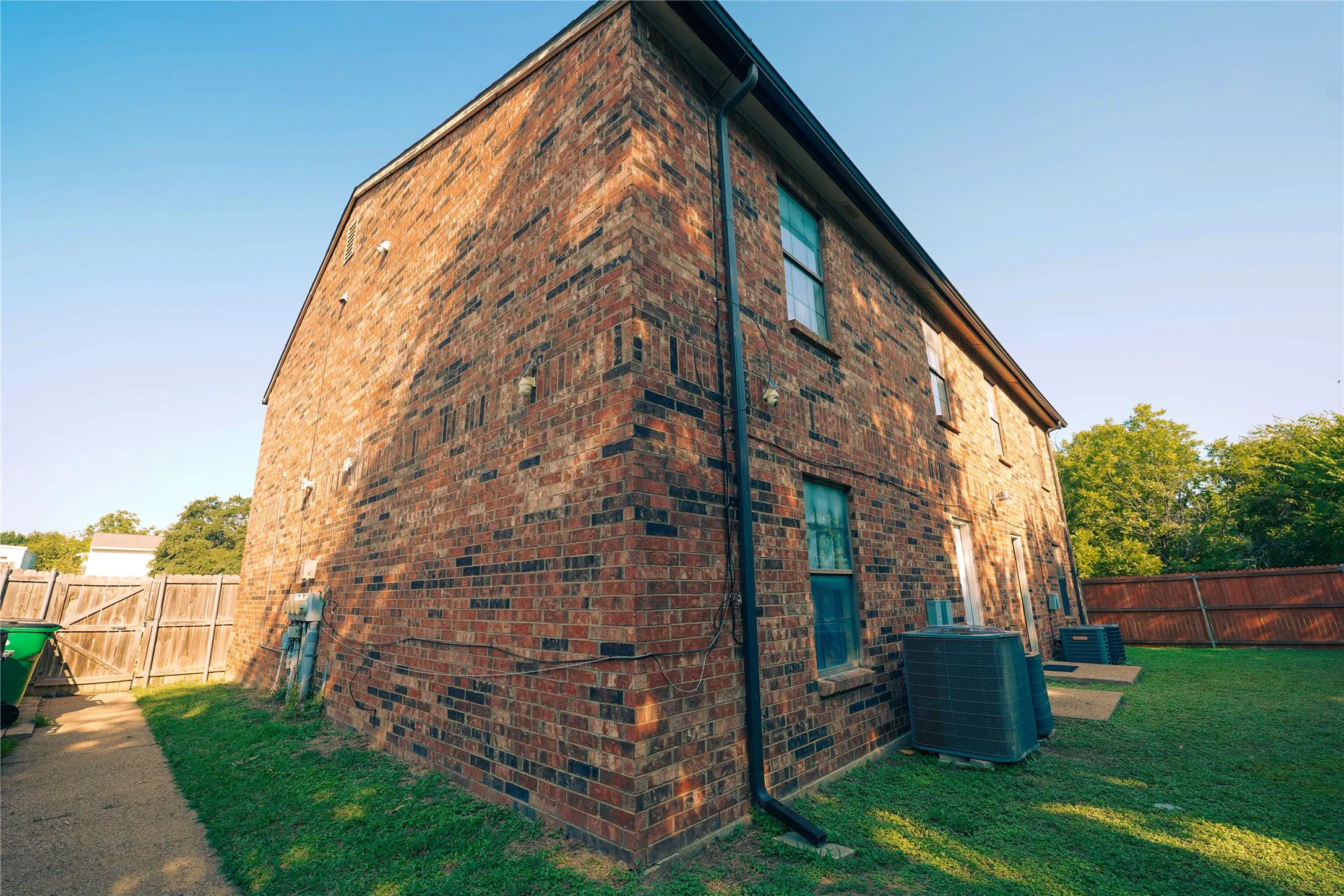 View of side of property with brick siding