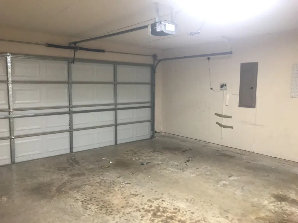 Two vehicle garage faces street.