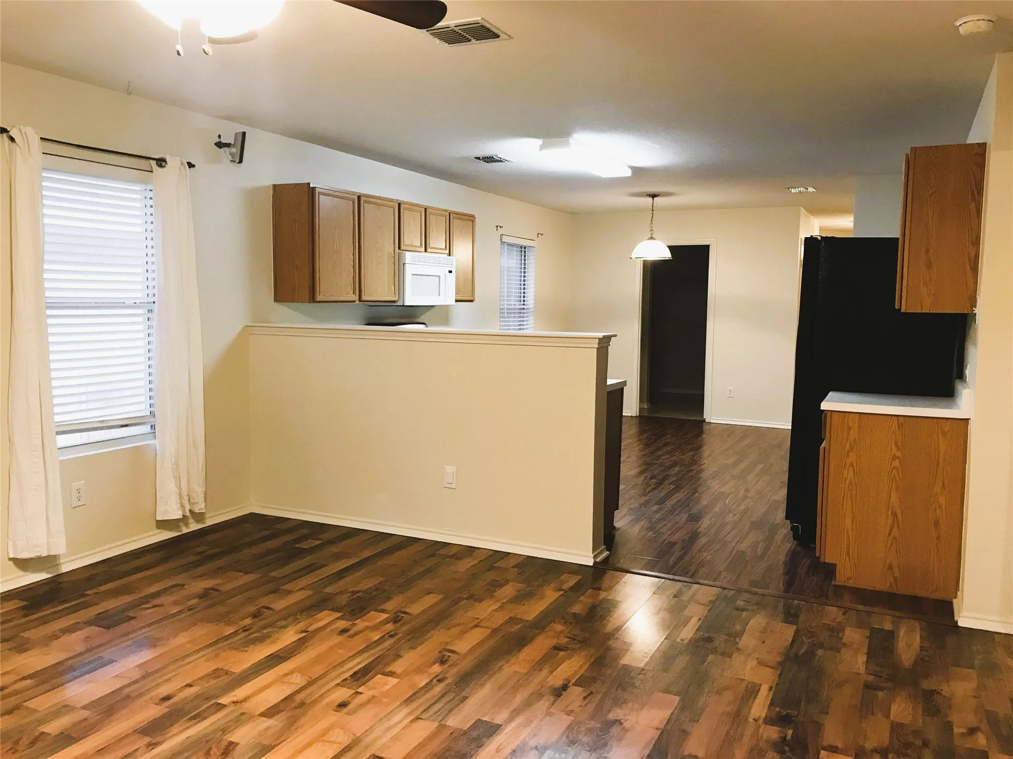 Laminate flooring in family, kitchen and dining areas.