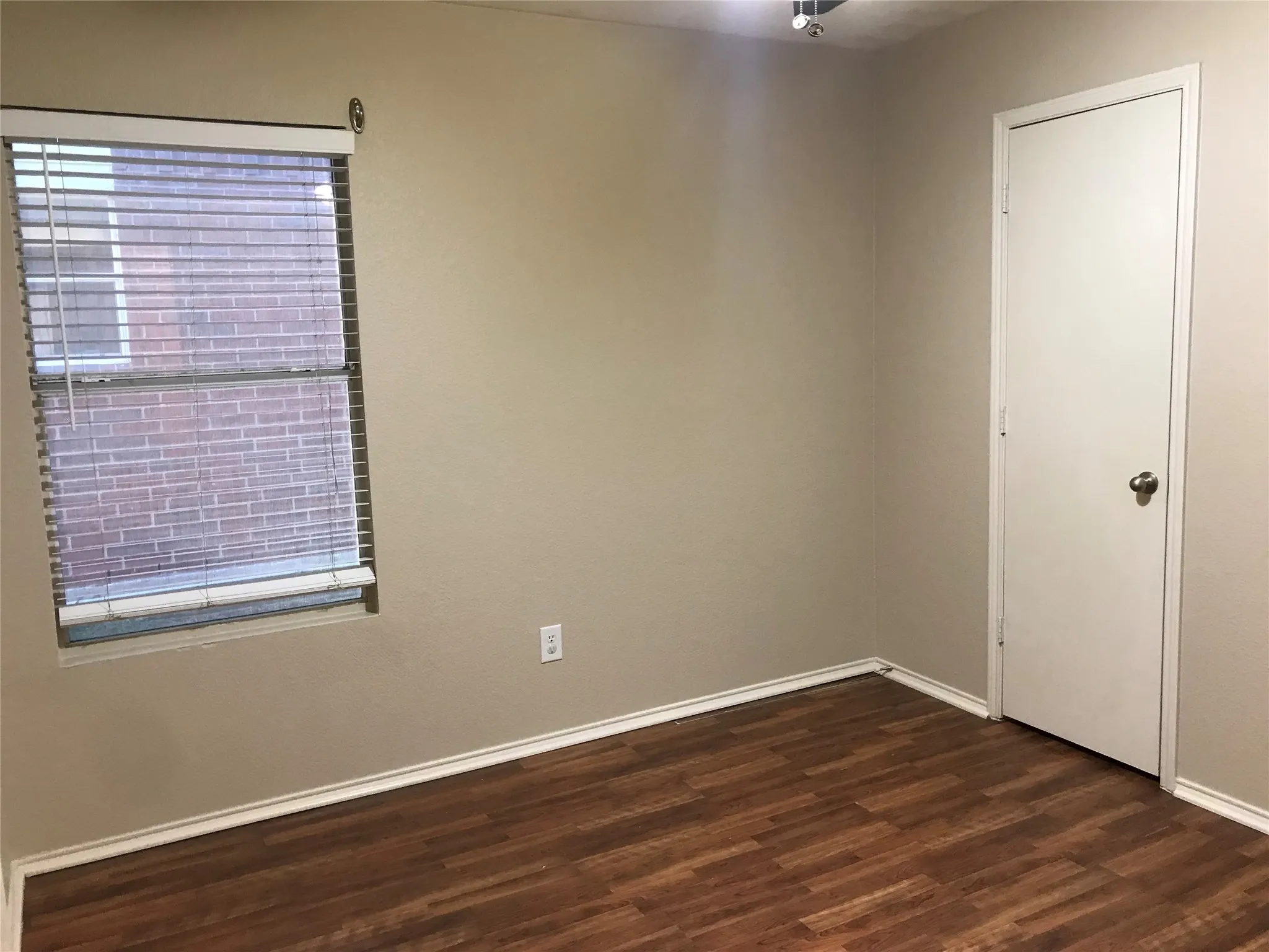 Ceiling fans and laminate wood floors in all bedrooms.