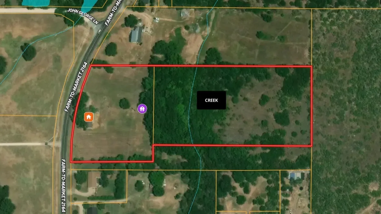 Boundary Map. Illustrating the property's perimeter, access roads, and location of home, barn and creek.