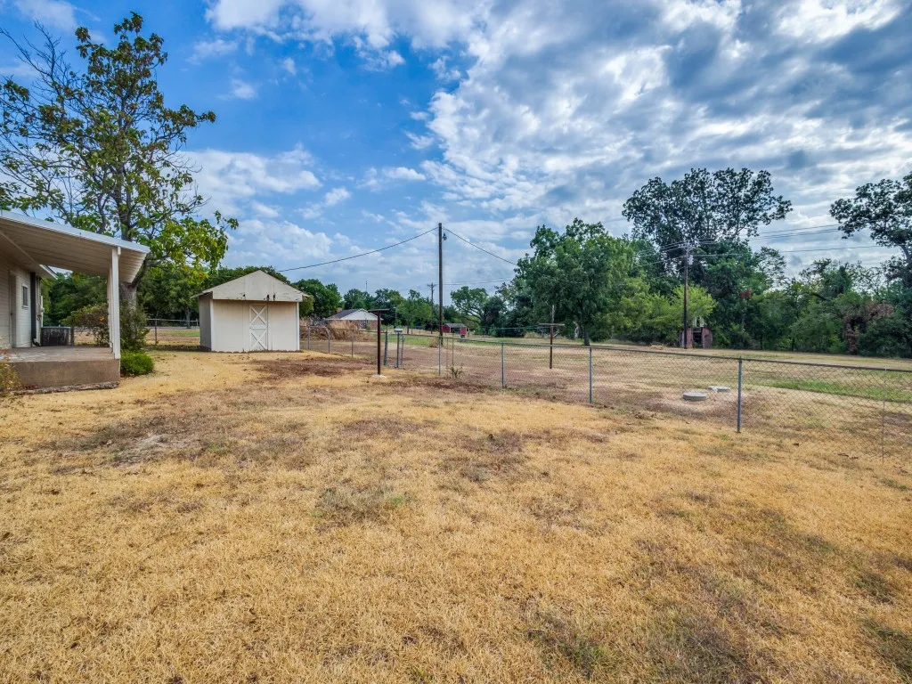 Looking out towards the back of the property.  You can see the red barn to the right.  The creek runs behind the treeline on the right.
