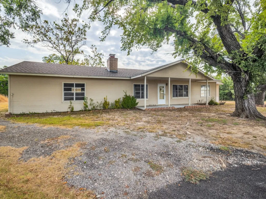 Welcome to this charming 1950's farmhouse on 8 acres conveniently located between Sanger and Denton.