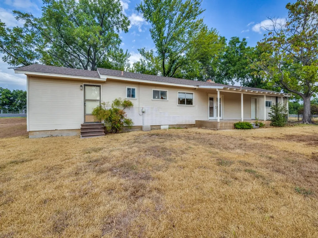 The back of the home also has a covered patio perfect for sitting outside and relaxing.