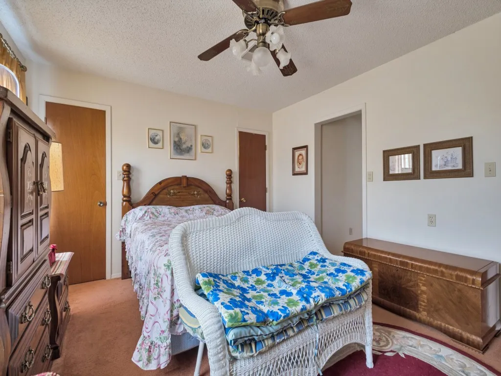 The primary bedroom features double closets on one wall and a large walk-in closet on the adjoining wall.