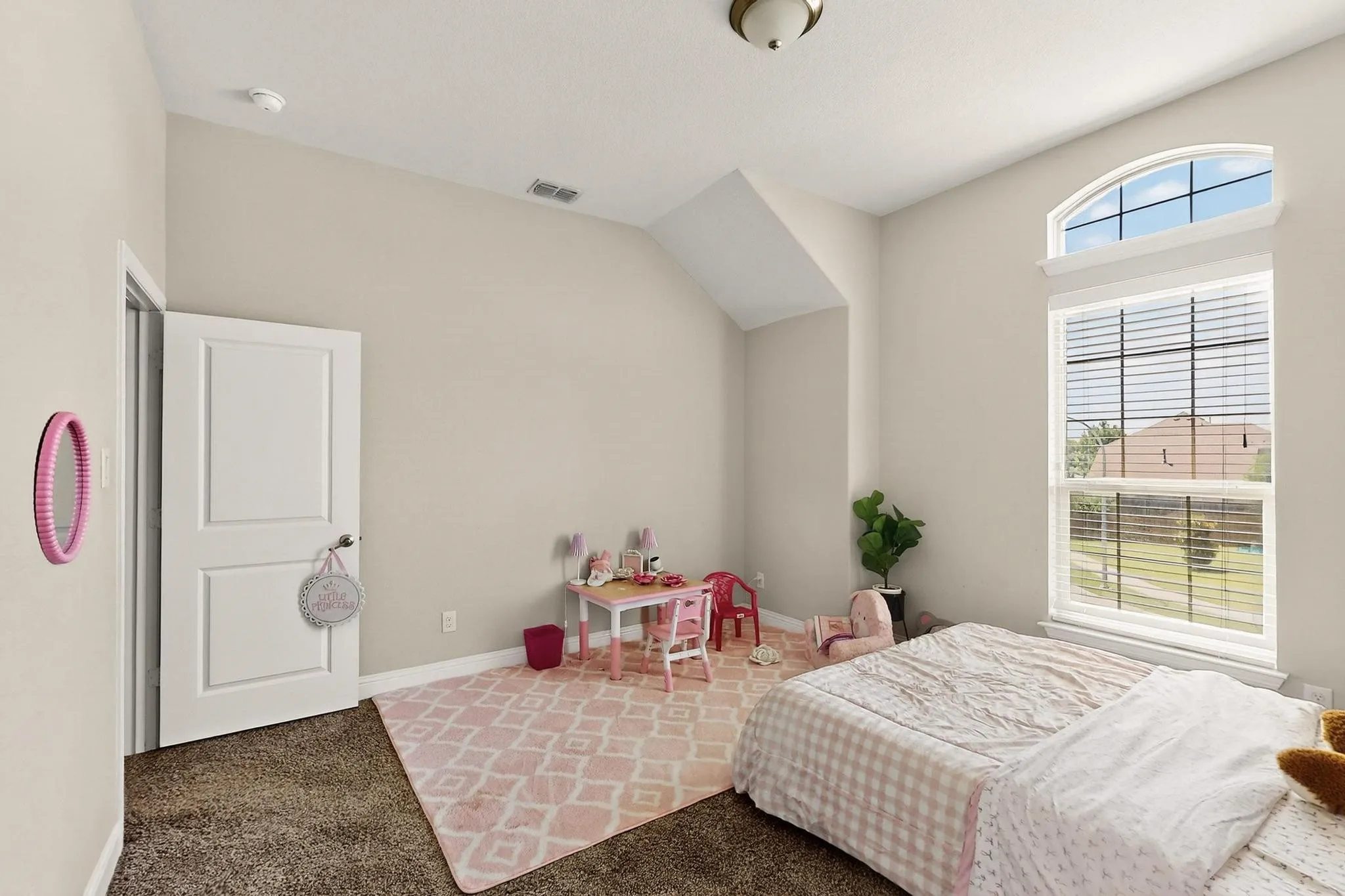 Carpeted bedroom with baseboards