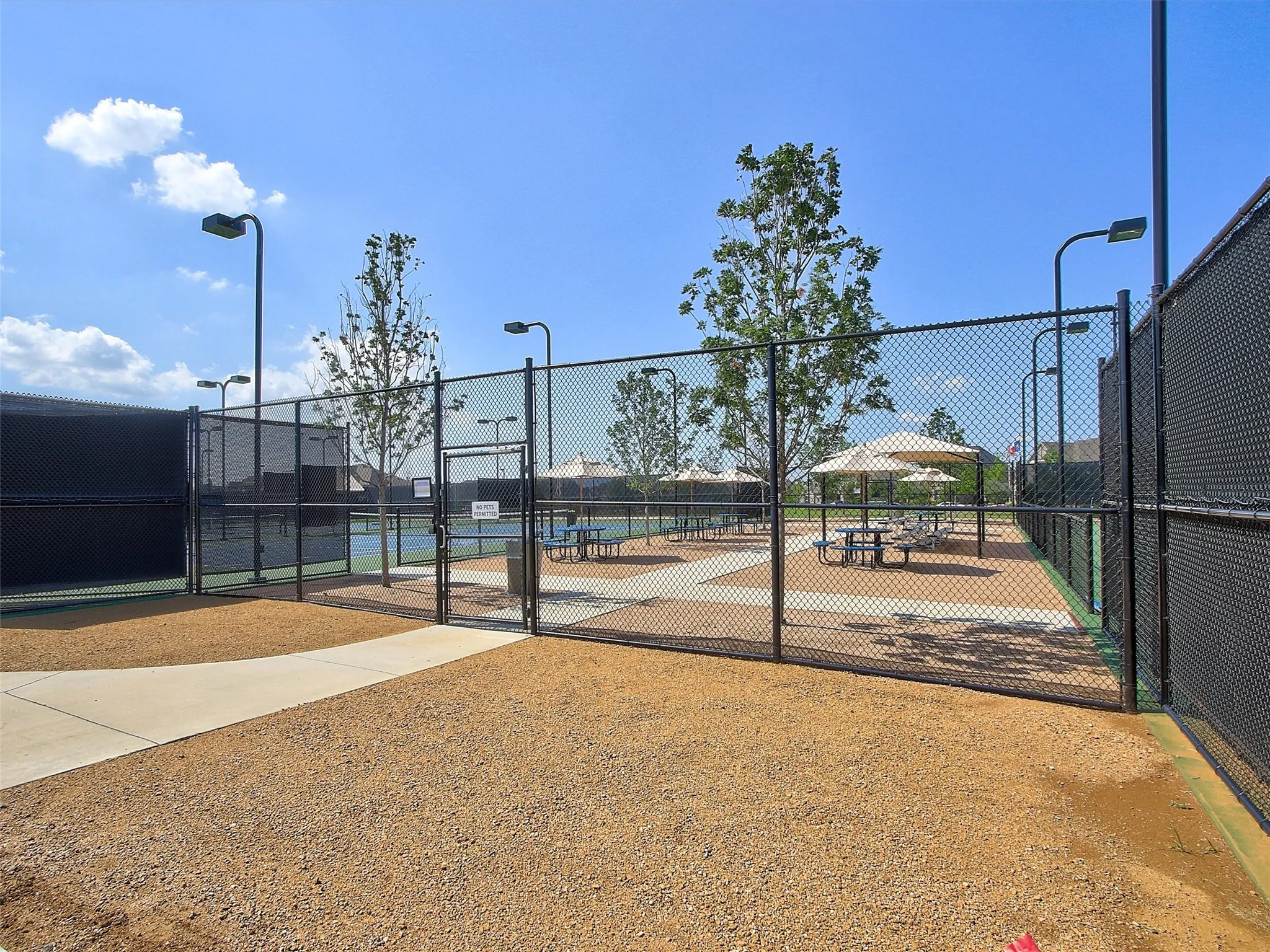 Enjoy a game of tennis close to home with community courts available to Windsong Ranch residents.