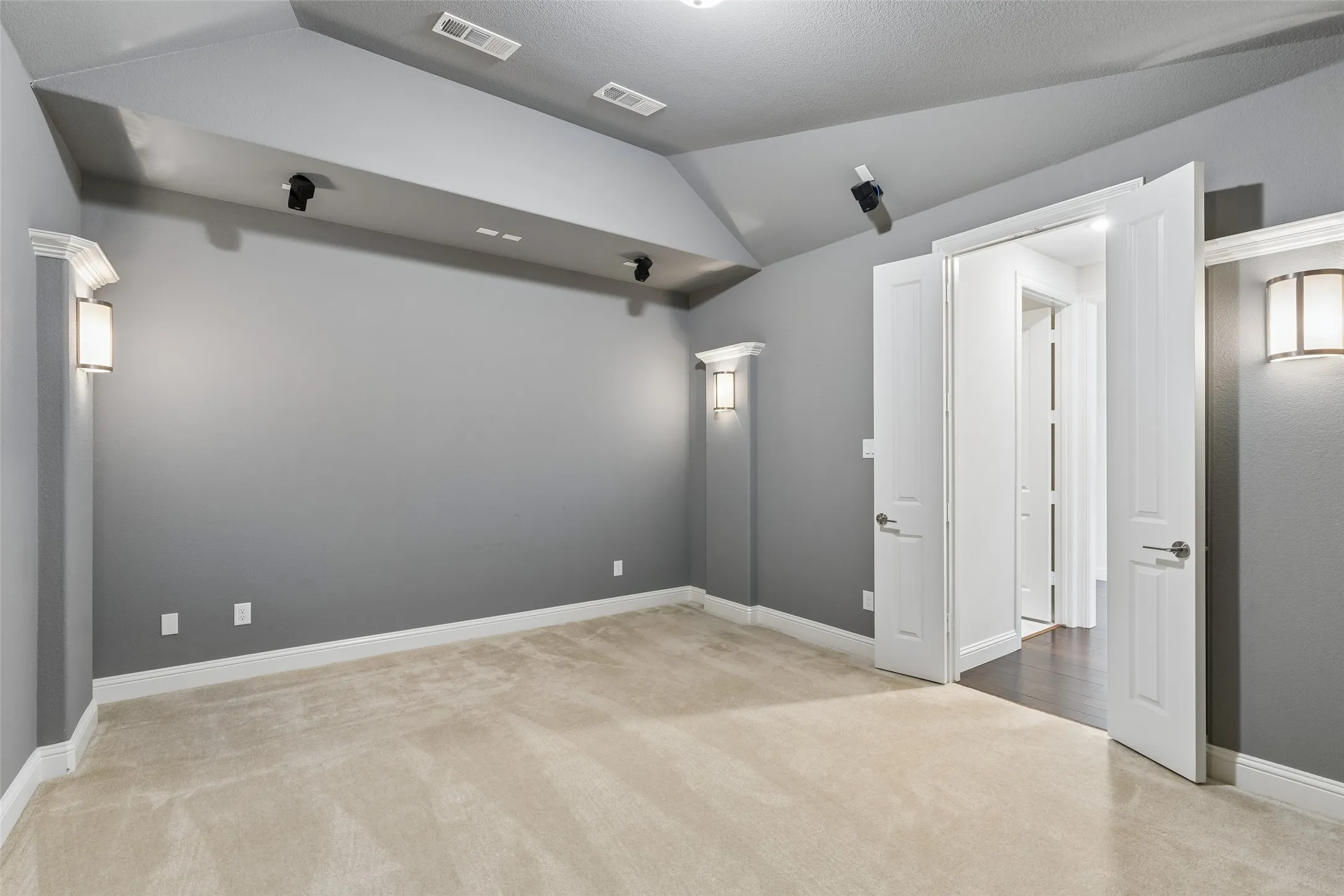 Dim the lights, turn on a favorite movie, and settle in—the windowless media room was designed for evenings like this.