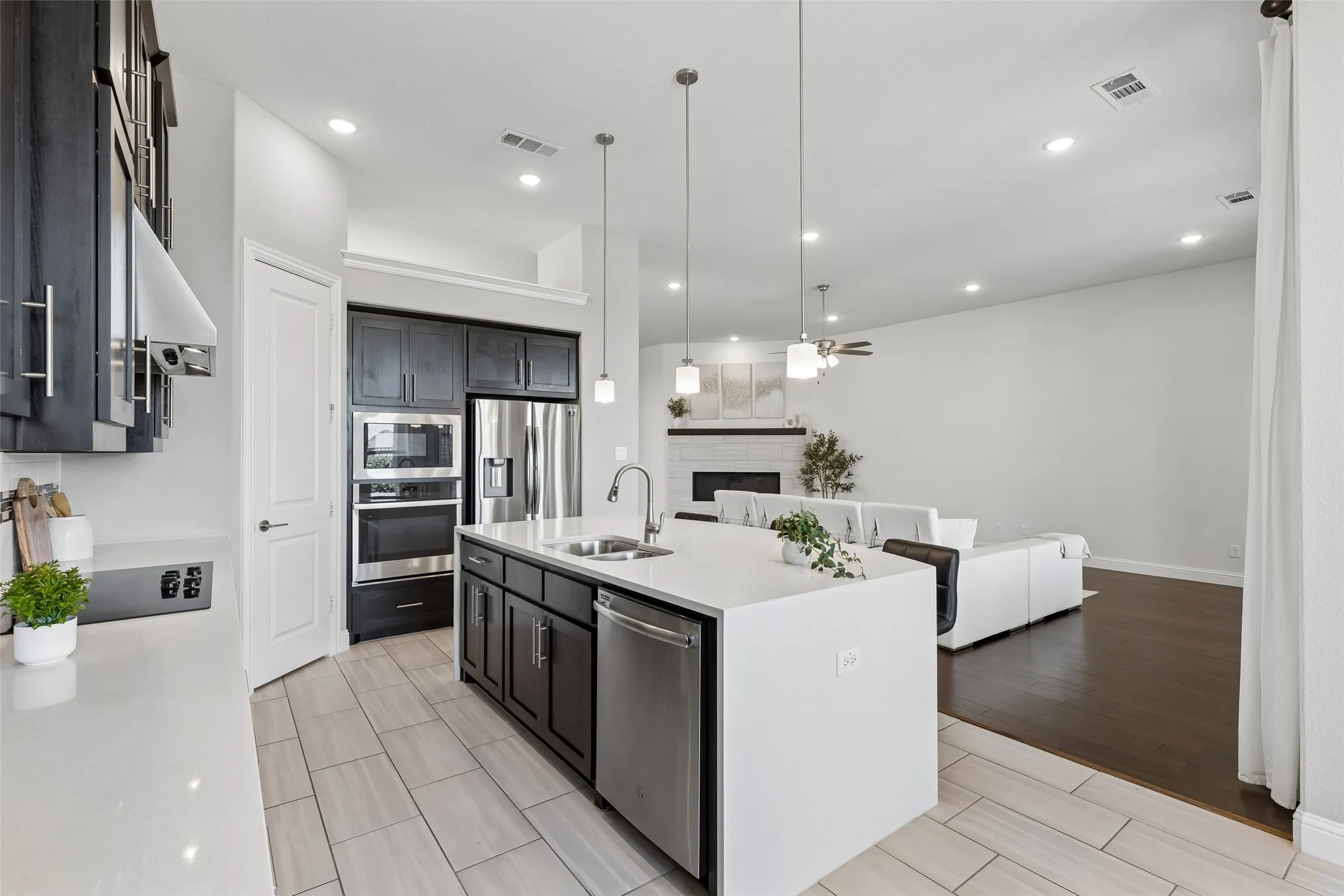 Cook without disappearing from the room—the kitchen stays connected to the living area so the conversation never has to stop.