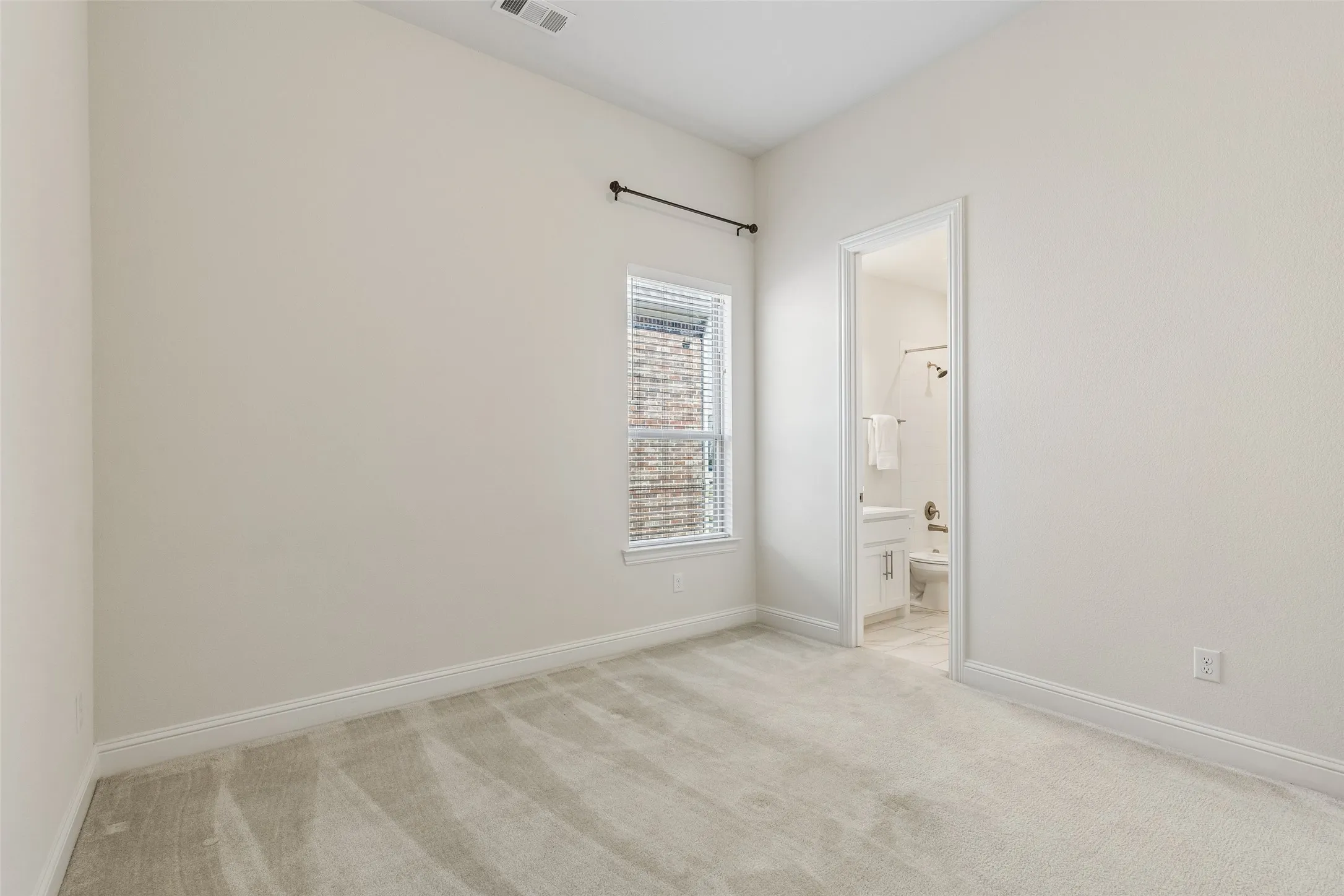 Another secondary bedroom offers room for family, guests, or someone ready to make the space entirely their own.