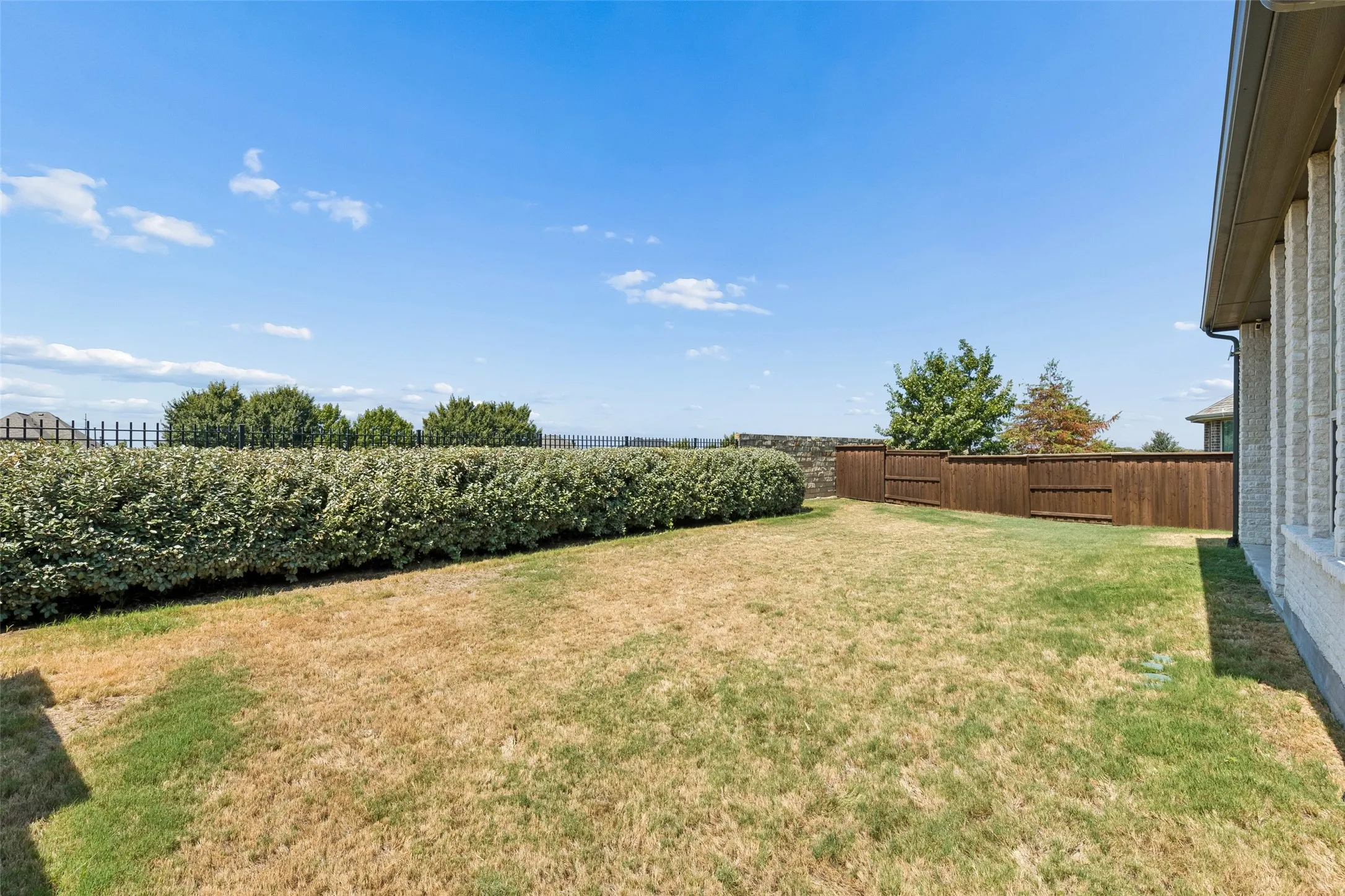 There’s room on the lawn for play, pets, a garden, or simply the freedom to enjoy an open backyard as it is with privacy.