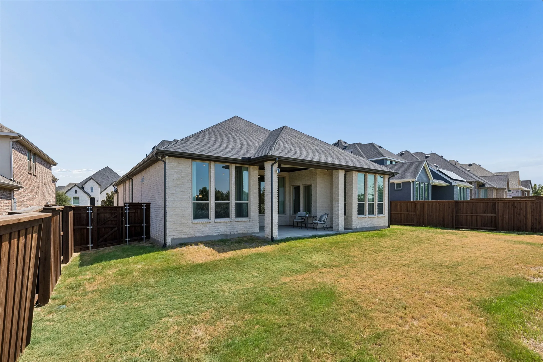 From morning coffee to warm Texas afternoons, the covered patio offers a pull-down shade for added comfort while keeping the backyard open for play, pets, and time outdoors.