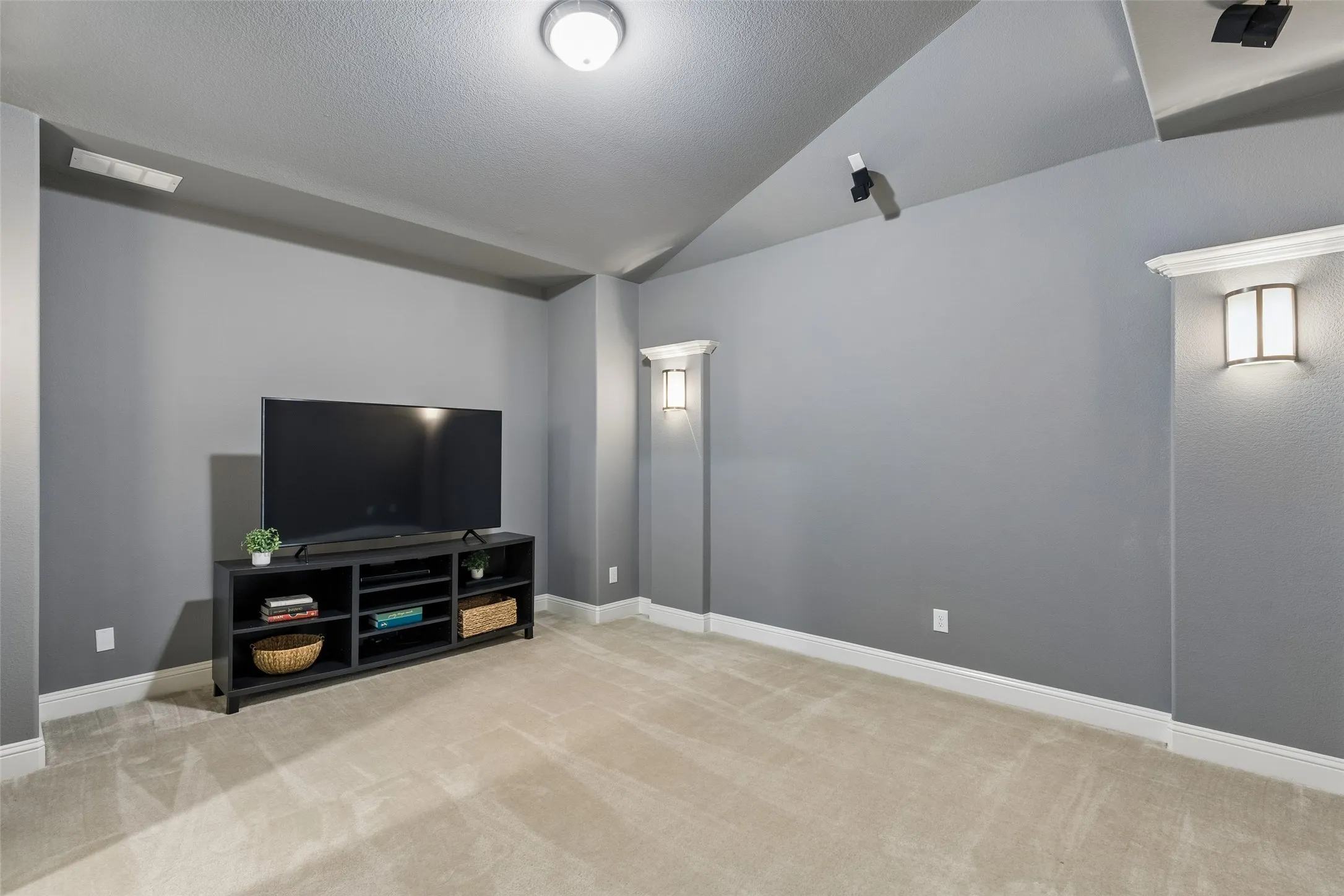 The existing speakers are already in place—just bring the movie, snacks, and your favorite seats.