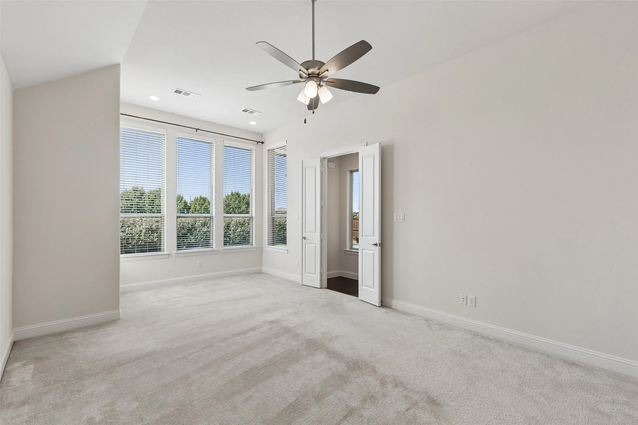 The primary suite gives you room beyond the bed, creating a natural place for a reading chair, morning coffee, or a quiet moment at the end of the day.