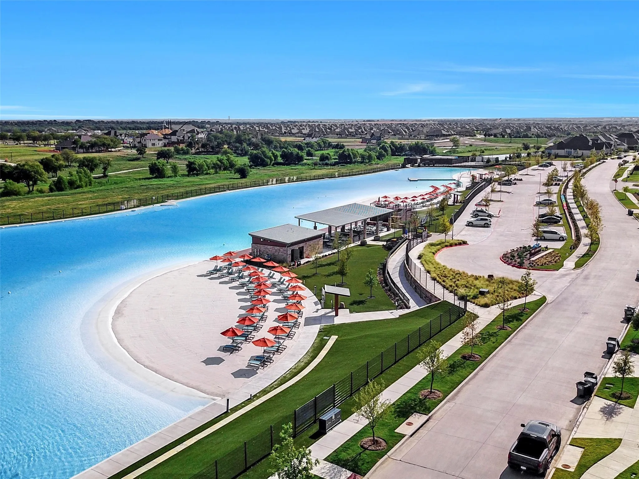 Just beyond the front door, Windsong Ranch brings a five-acre crystal-clear lagoon and sandy beaches into everyday neighborhood life.
