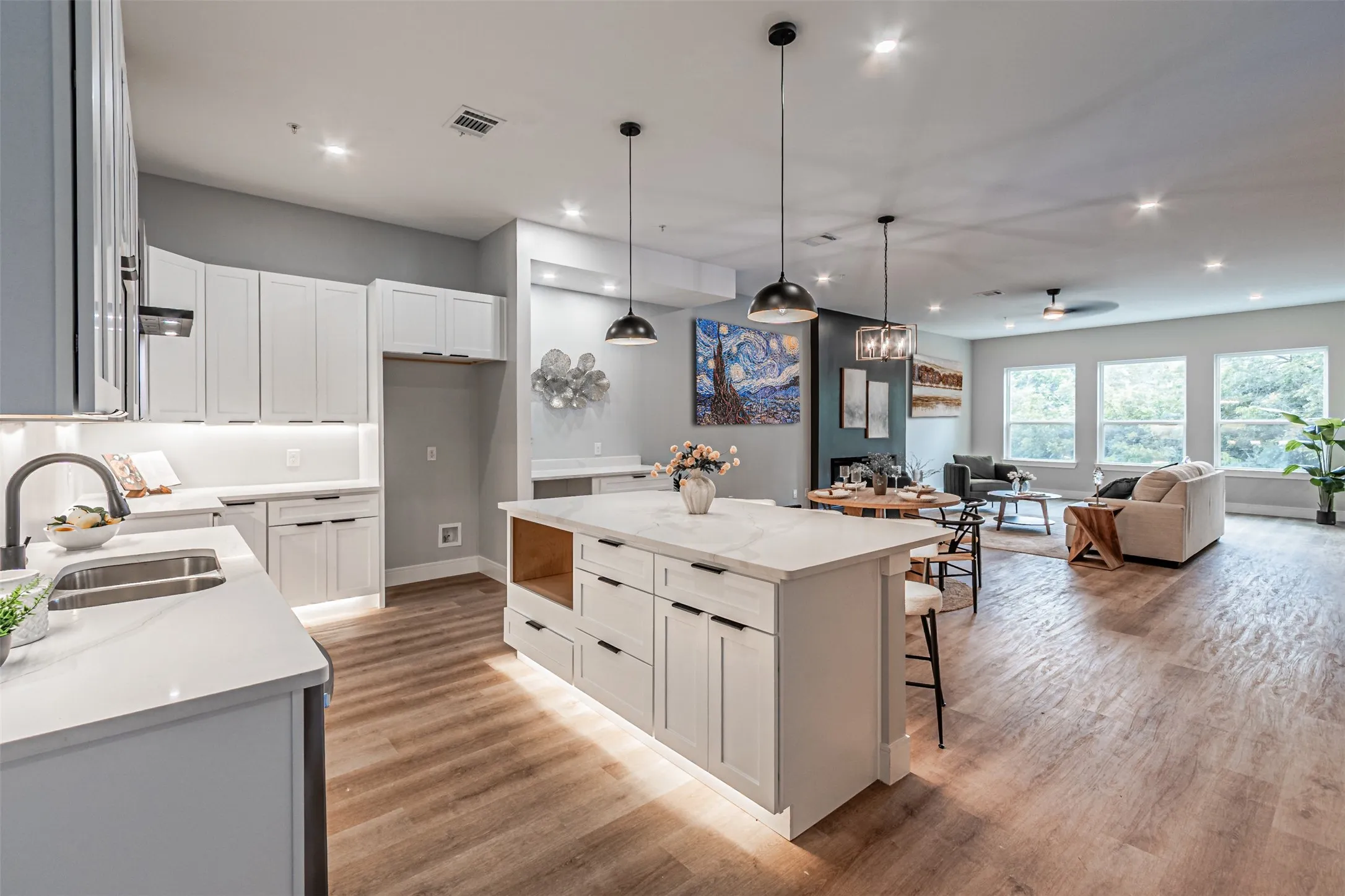 THE KITCHEN ISLAND DOUBLES AS A BREAKFAST BAR