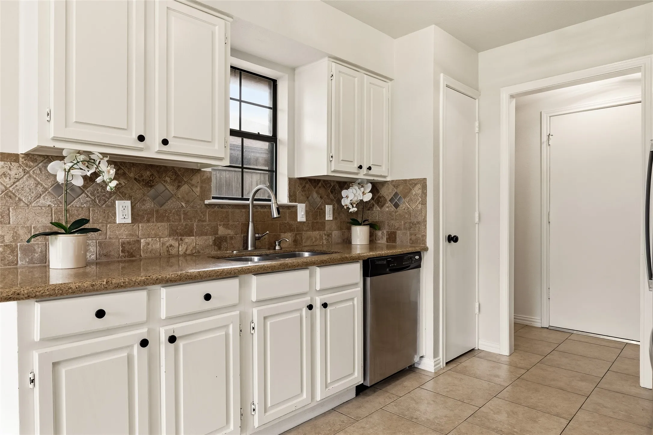 Access to laundry area and attached 2 car garage